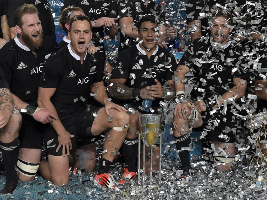 New Zealand celebrate after they retained the Rugby Championship following their 34-13 win over Argentina in September 2014. Photo: AFP
