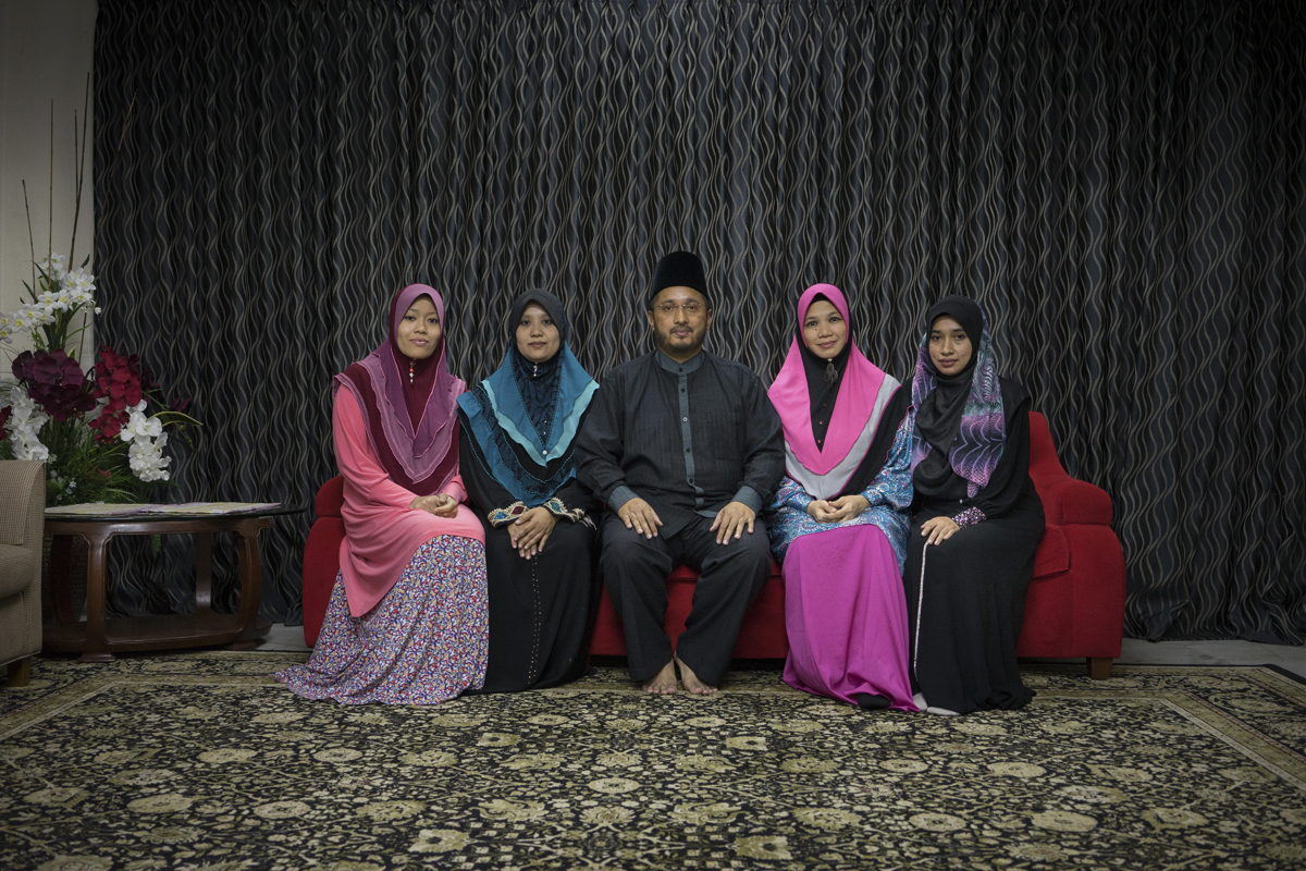Global Ikhwan chief executive Lokman Hakim with his wives. Photos: Thomas Cristofoletti