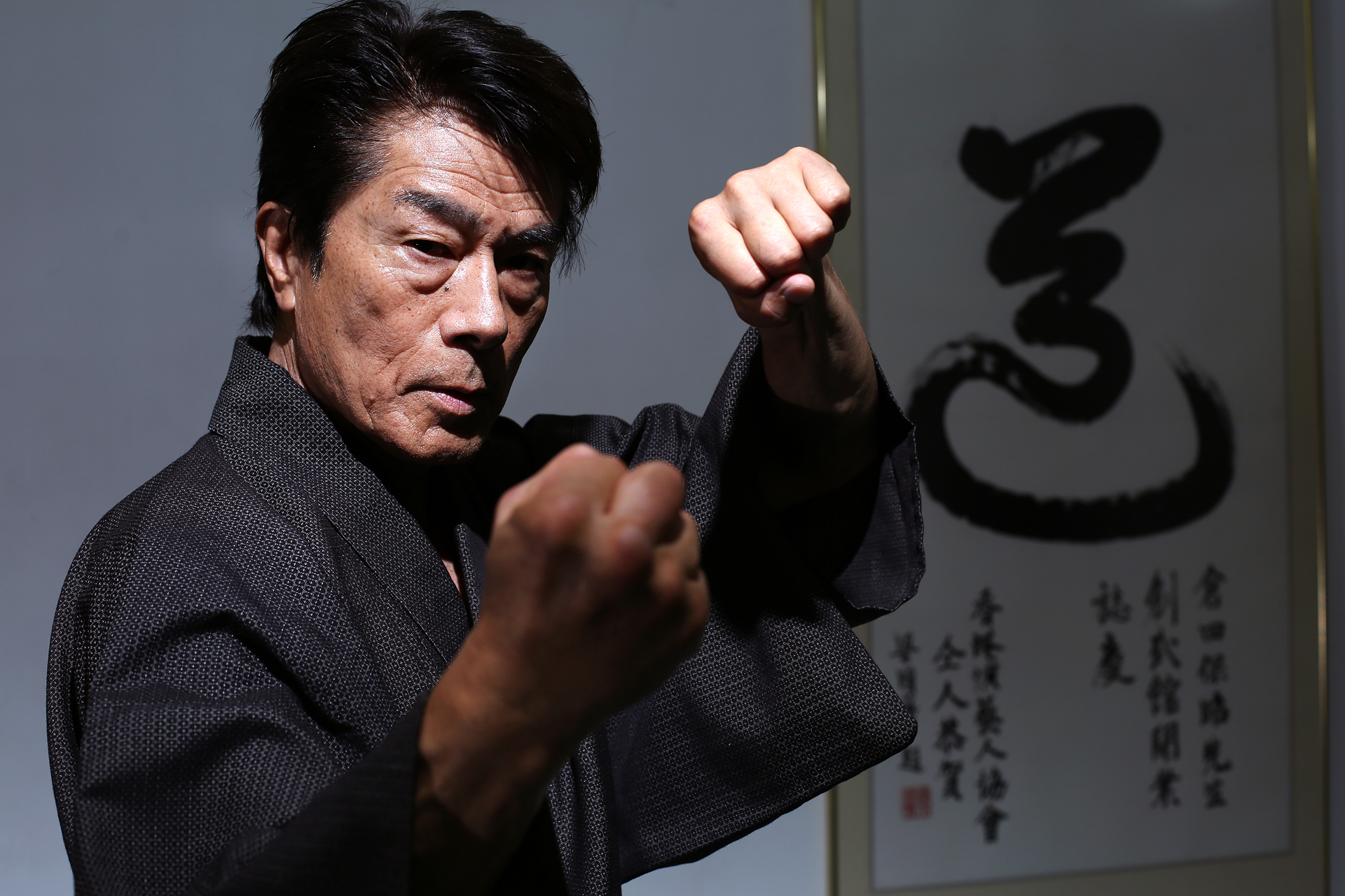 69-year-old Japanese kung fu master Yasuaki Kurata poses for picture at his karate school in Causeway Bay. Kurata is in town to hold a Kendo seminar for martial arts enthusiasts. Photo: Nora Tam