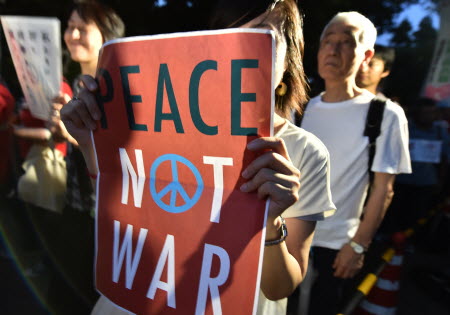 Japanese protesters made their views clear about Shinzo Abe's manipulation of the law regarding military involvement. Photo: AFP