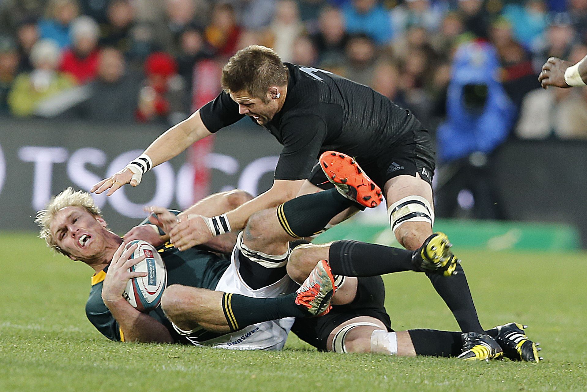 Captains Schalk Burger of the Springboks and Richie McCaw of the All Blacks tangle in their Rugby Championship clash in Johannesburg. New Zealand won 27-20. Photo: AFP