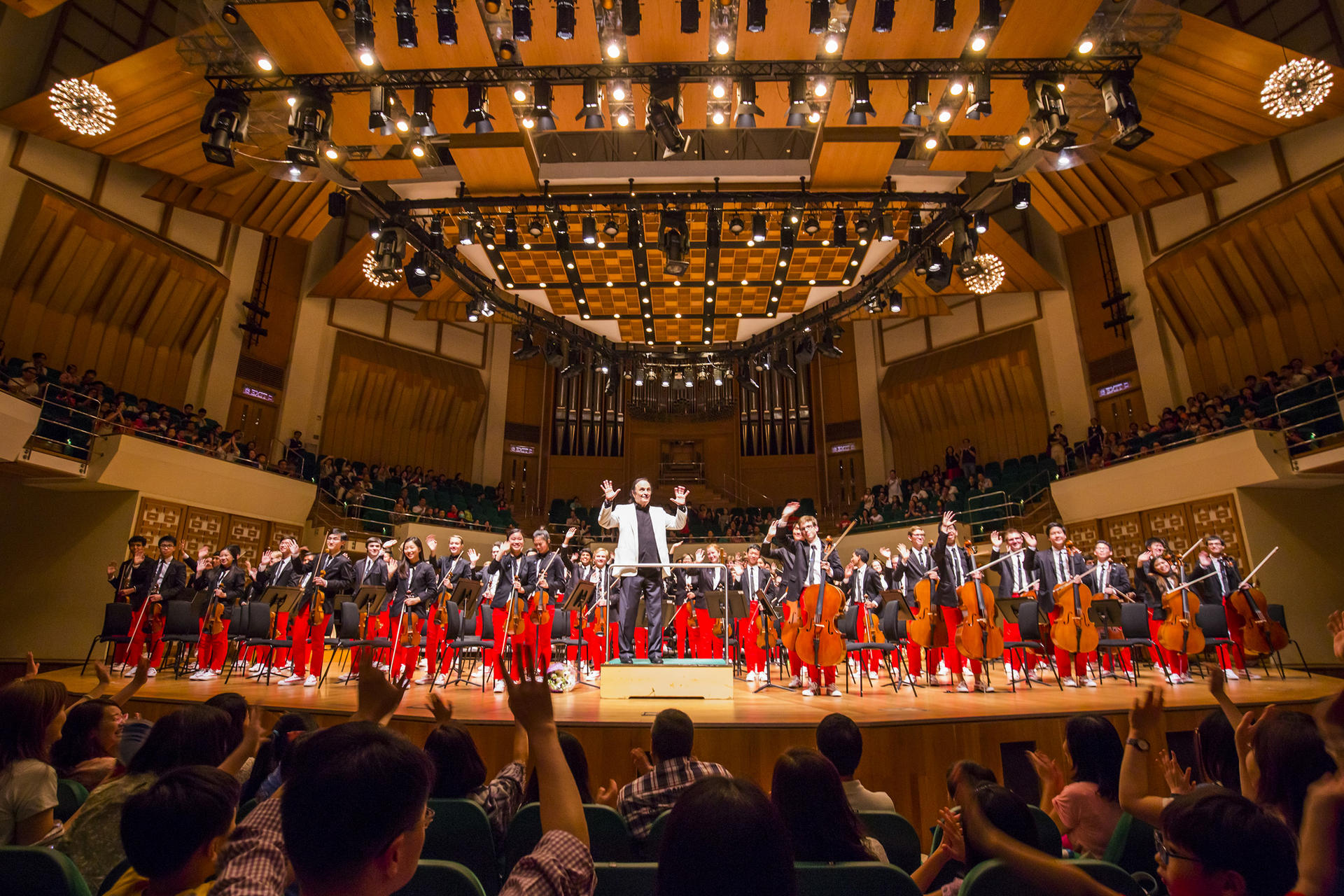 The National Youth Orchestra of the United States of America and conductor Charles Dutoit bask in the applause of the Cultural Centre audience. Photo: Chris Lee