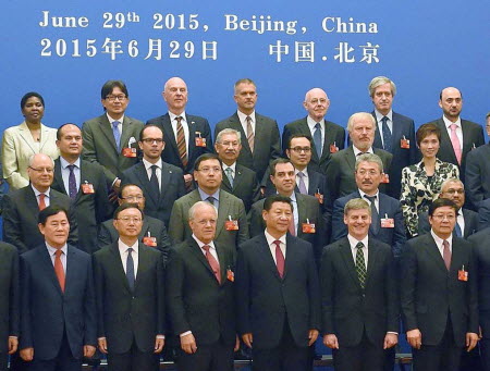 President Xi Jinping (bottom row, fourth left) and other AIIB delegates, some from countries that are sceptical of China's leadership in the venture. Photo: Kyodo