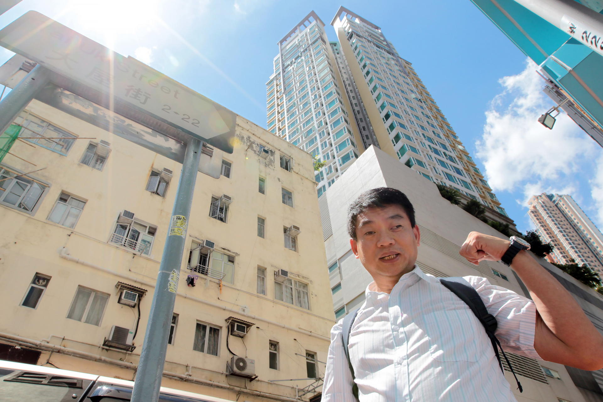 Tai Uk Wai village head Albert Cheung in front of the Blue Yard, a residential property in Tsuen Wan. Photos: Bruce Yan