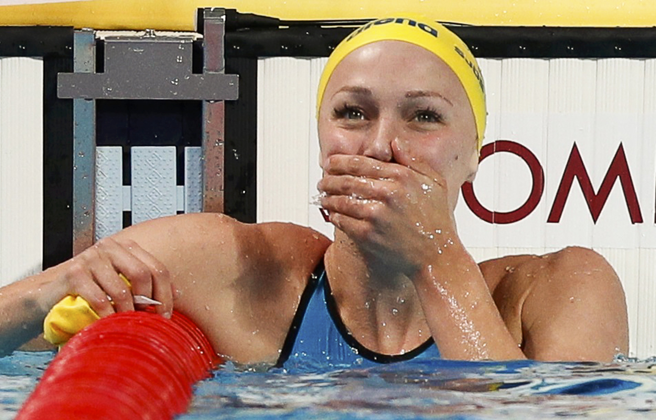 Sarah Sjostrom of Sweden reacts after setting a new world record in women's 100m butterfly final. Photo: Reuters
