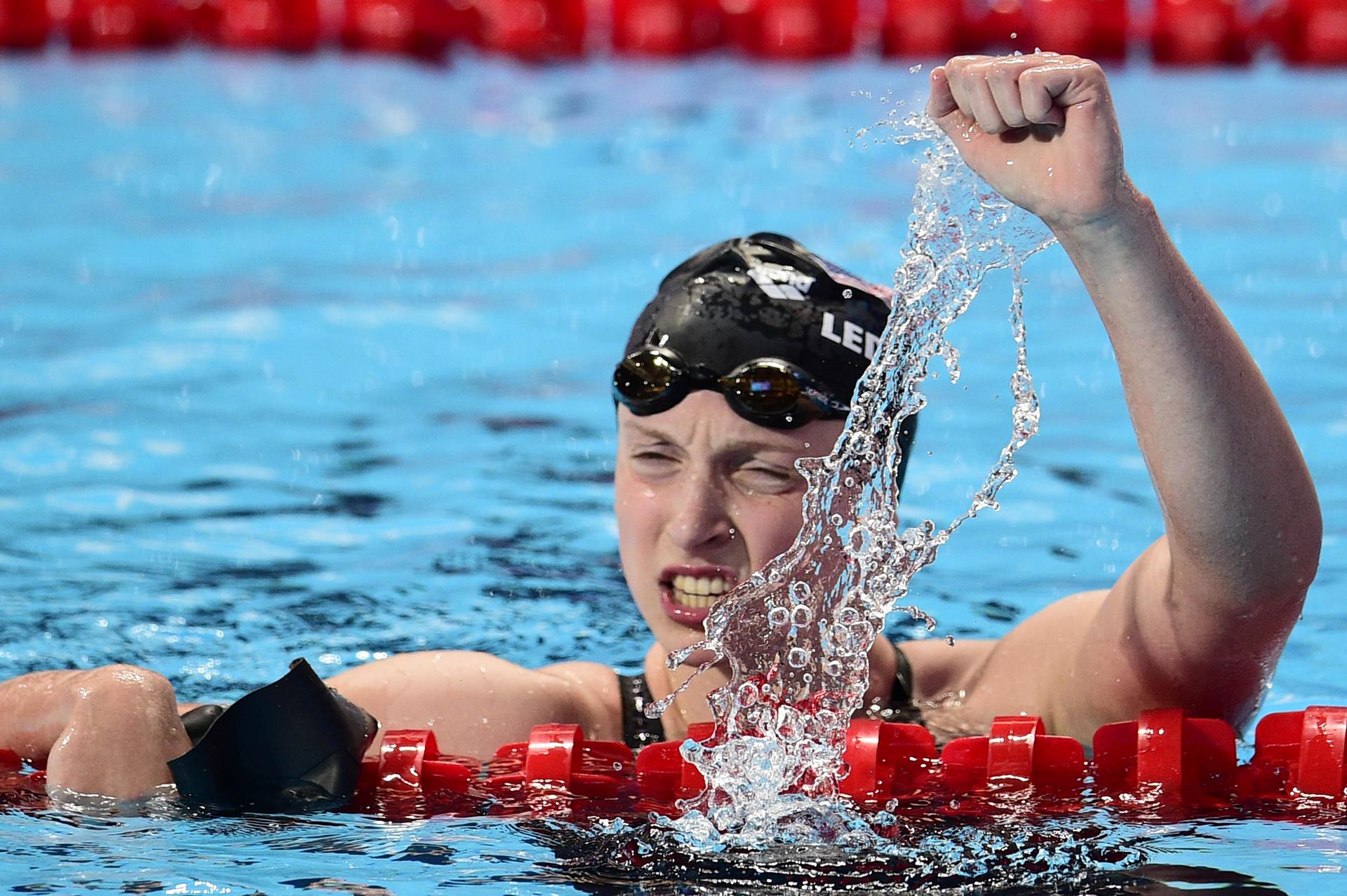 Katie Ledecky of the United States celebrates setting a world record in winning the final of the women's 1,500m freestyle at the world championships in Kazan. Photos: AFP