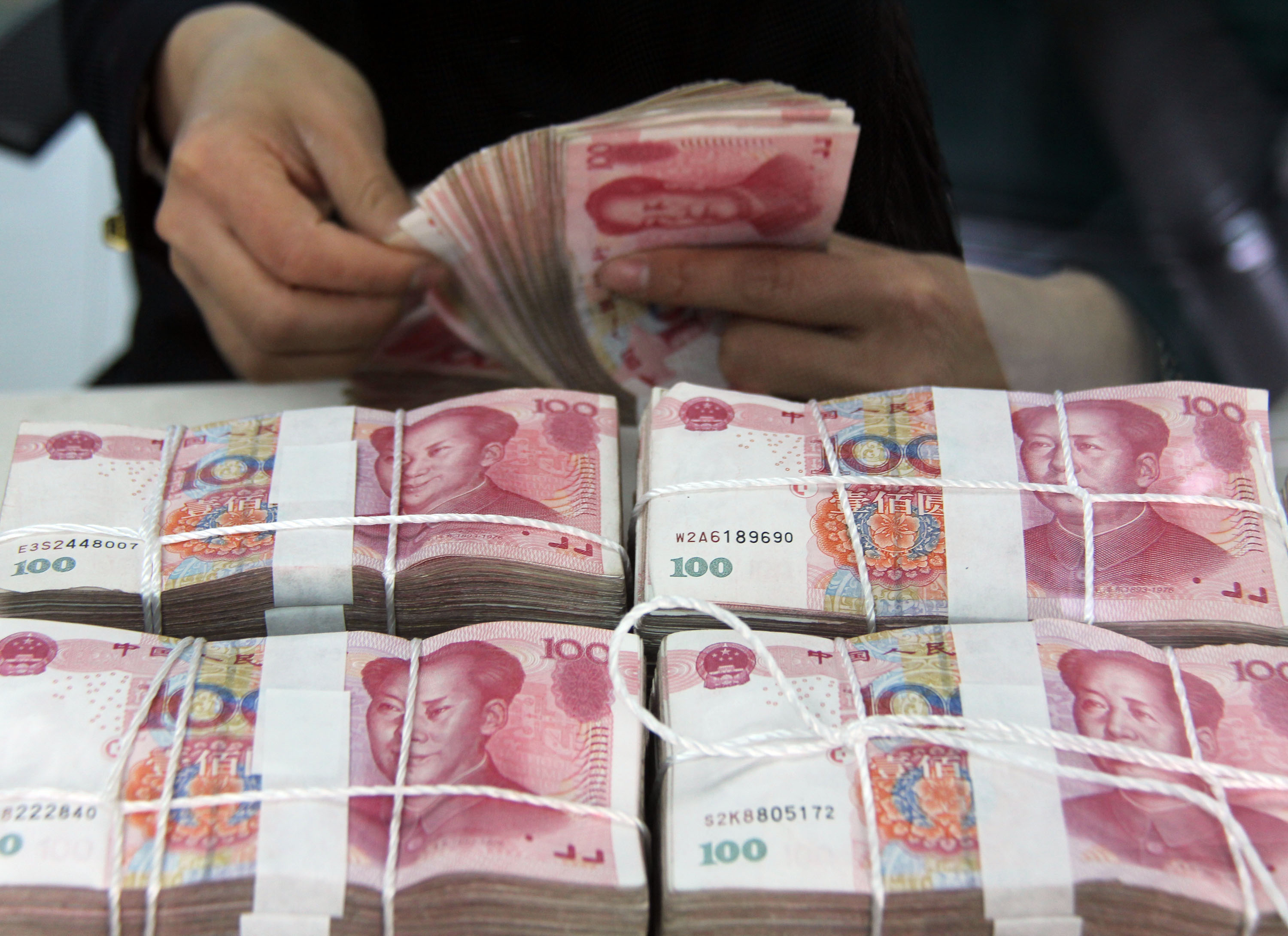 There are still a lot of technical considerations to be finalised before yuan could join the IMF's basket of reserve currencies. Photo: Xinhua 