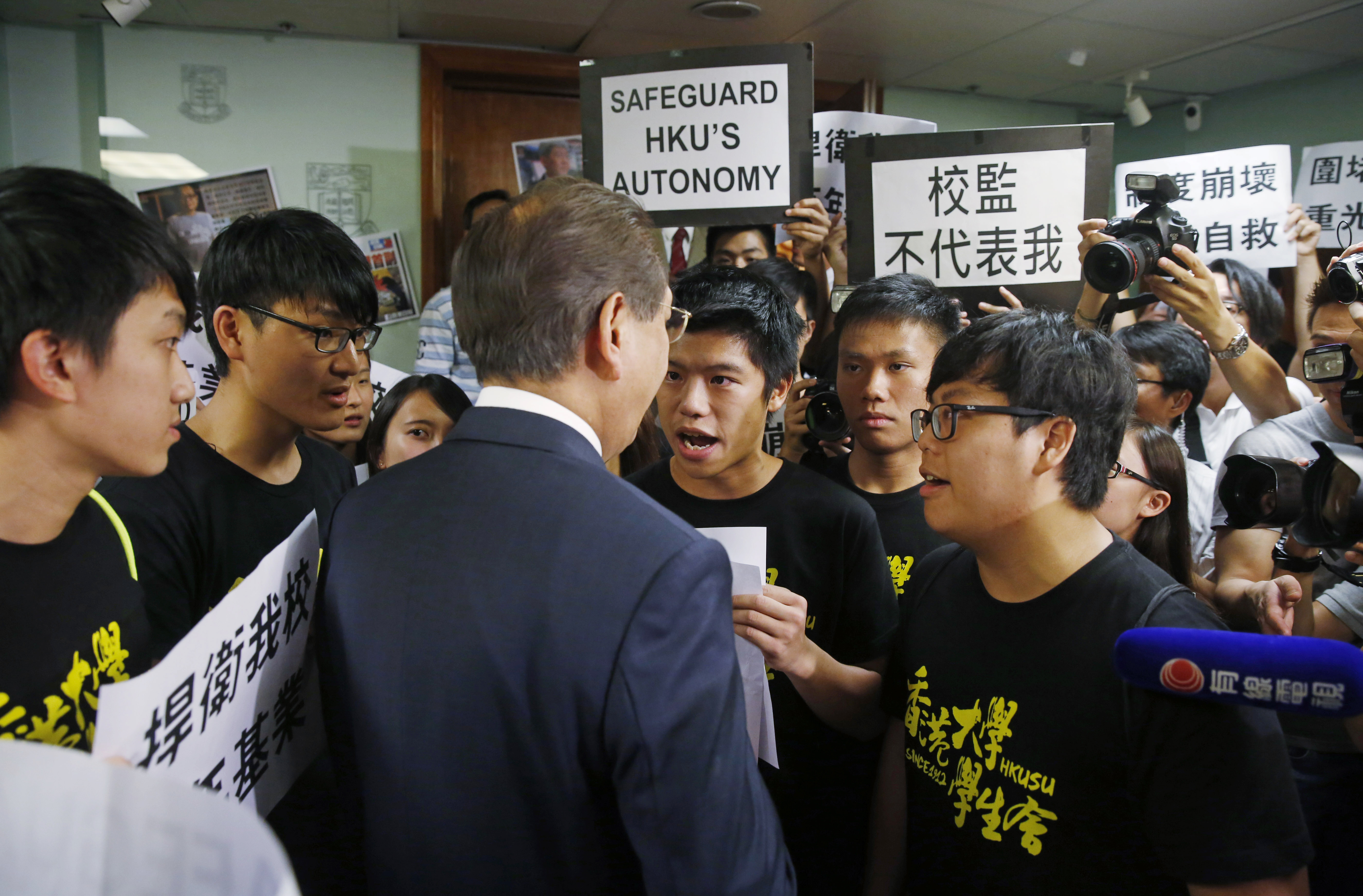 Students invaded the council meeting after members voted down a motion to stop delaying the pro-vice-chancellor appointment last month. Photo: AP