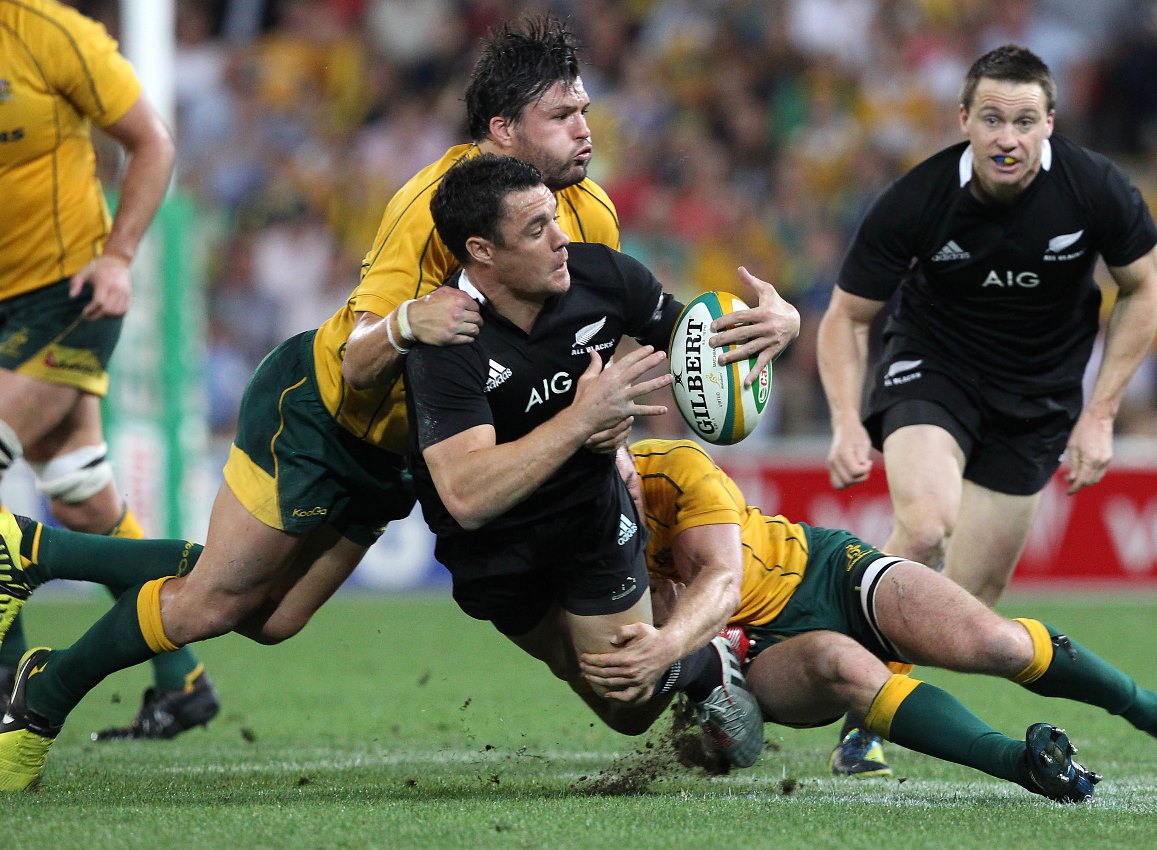 All Blacks fly-half Dan Carter (the all-time highest international point scorer) is tackled by Wallabies right wing Adam Ashley-Cooper (scorer of more tries against New Zealand than any other player) during a Rugby Championship Bledisloe Cup match. Photo: AP