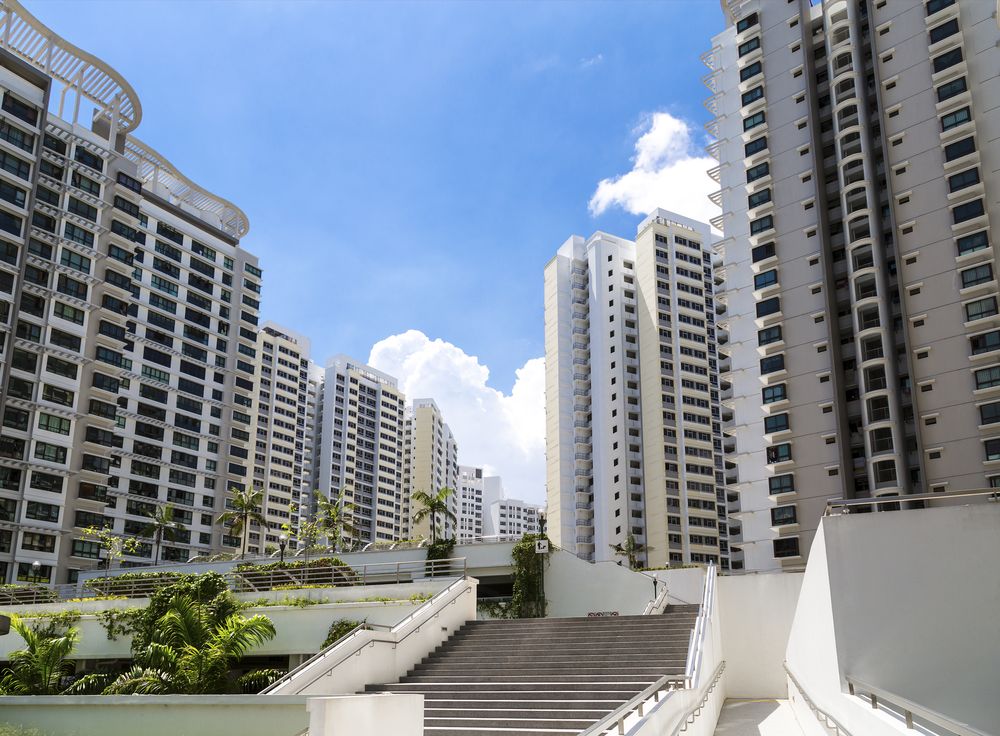 Public housing is easier to implement in Singapore as the government controls most of the land.