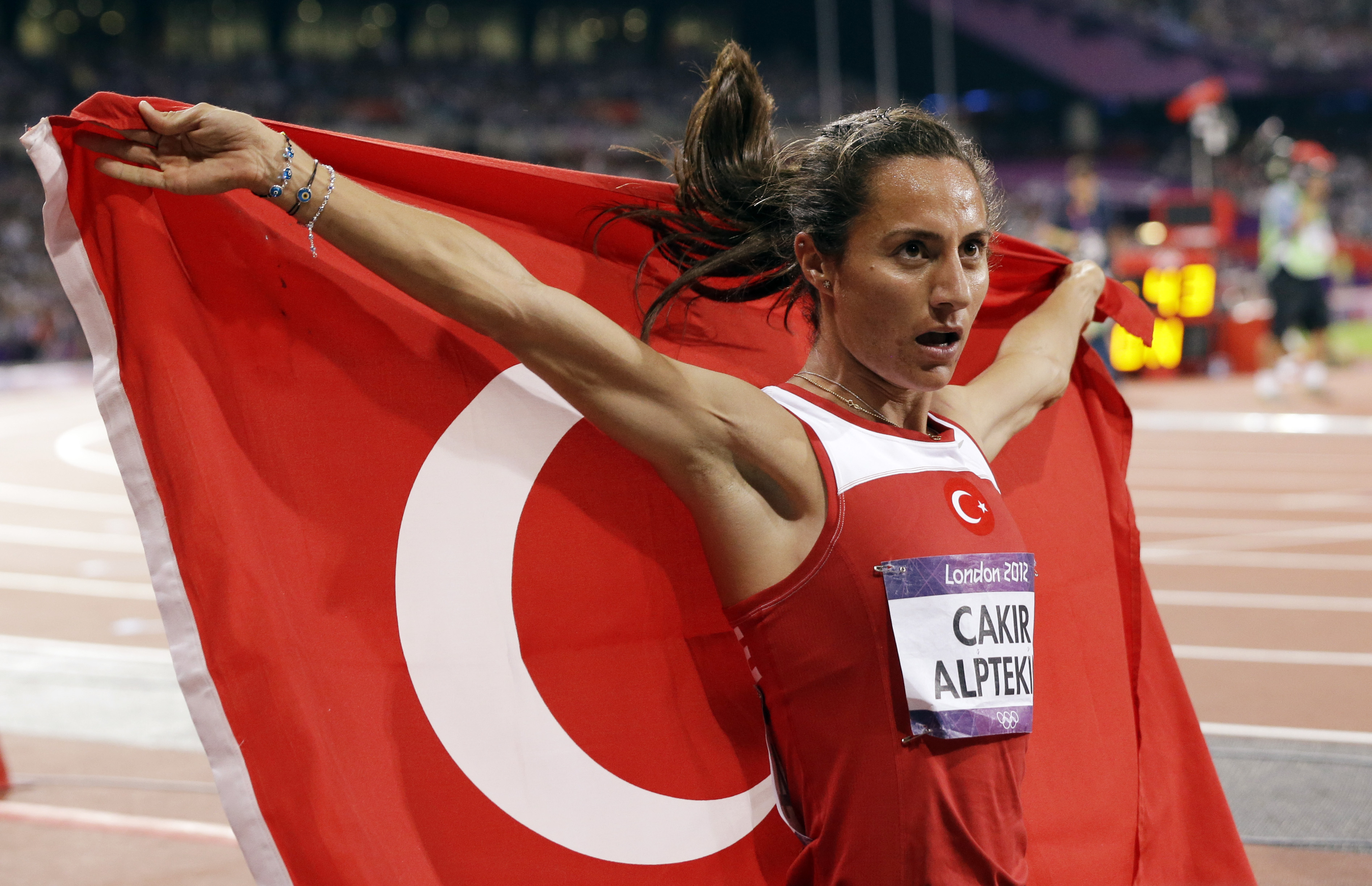 Asli Cakir Alptekin celebrates after winning the women's 1,500 metres gold medal at the 2012 London Olympic Games. She has been stripped of the medal and banned for eight years for doping. Photos: AP