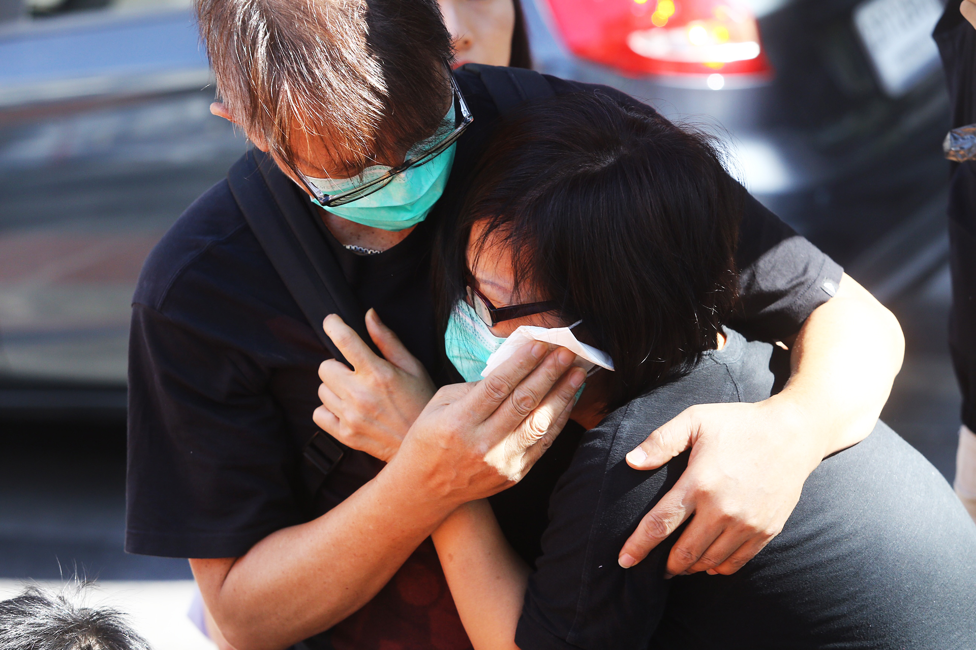 Parents of the 19-year-old victim Vivian Chan Wing-yan hugged each other in tears. Photo: Sam Tsang