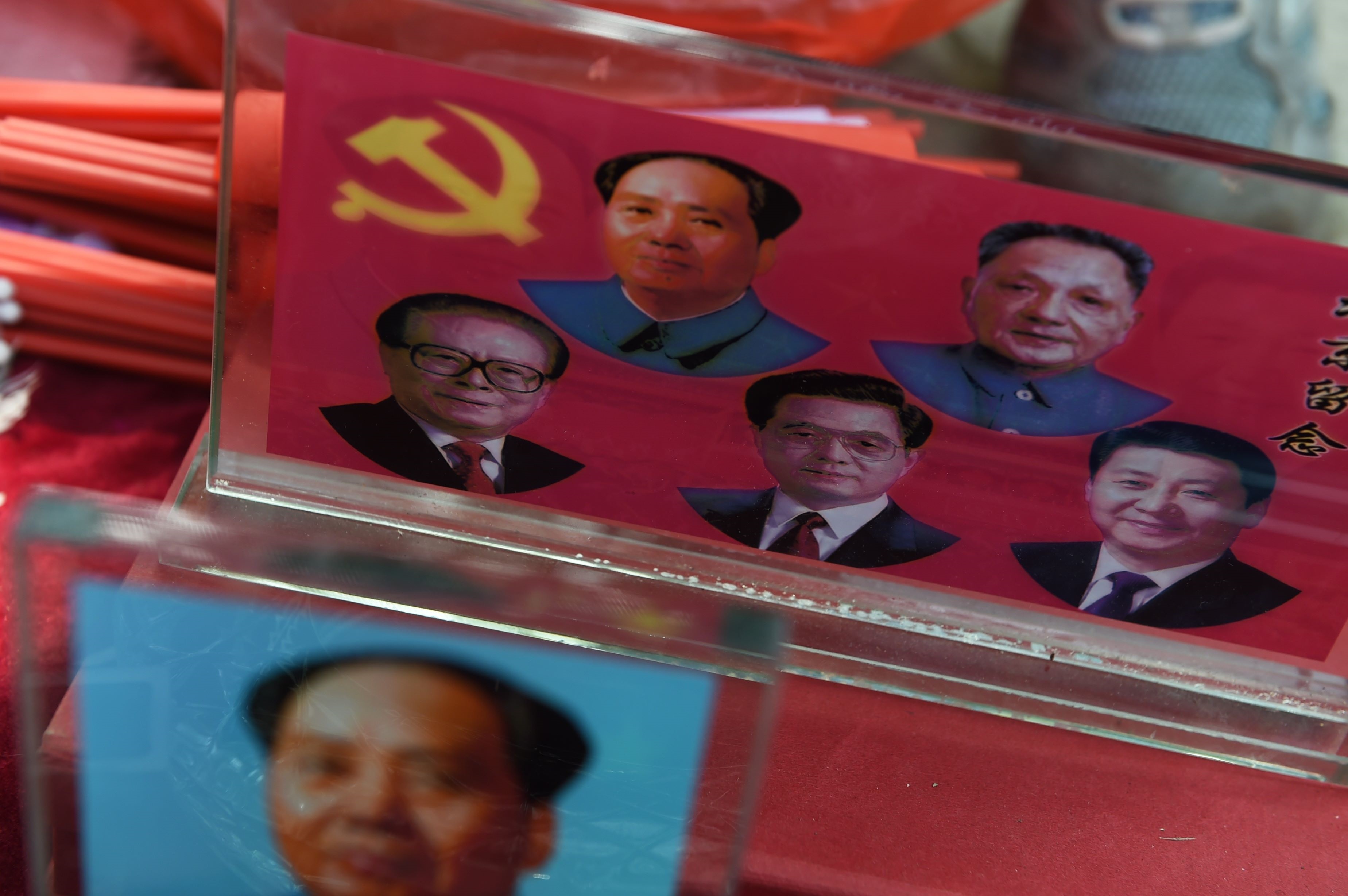 Portraits of China's current and former leaders at a trinket stall in Beijing. Analysts say retired leaders could be one of the groups resisting President Xi's reform ambitions. Photo: AFP