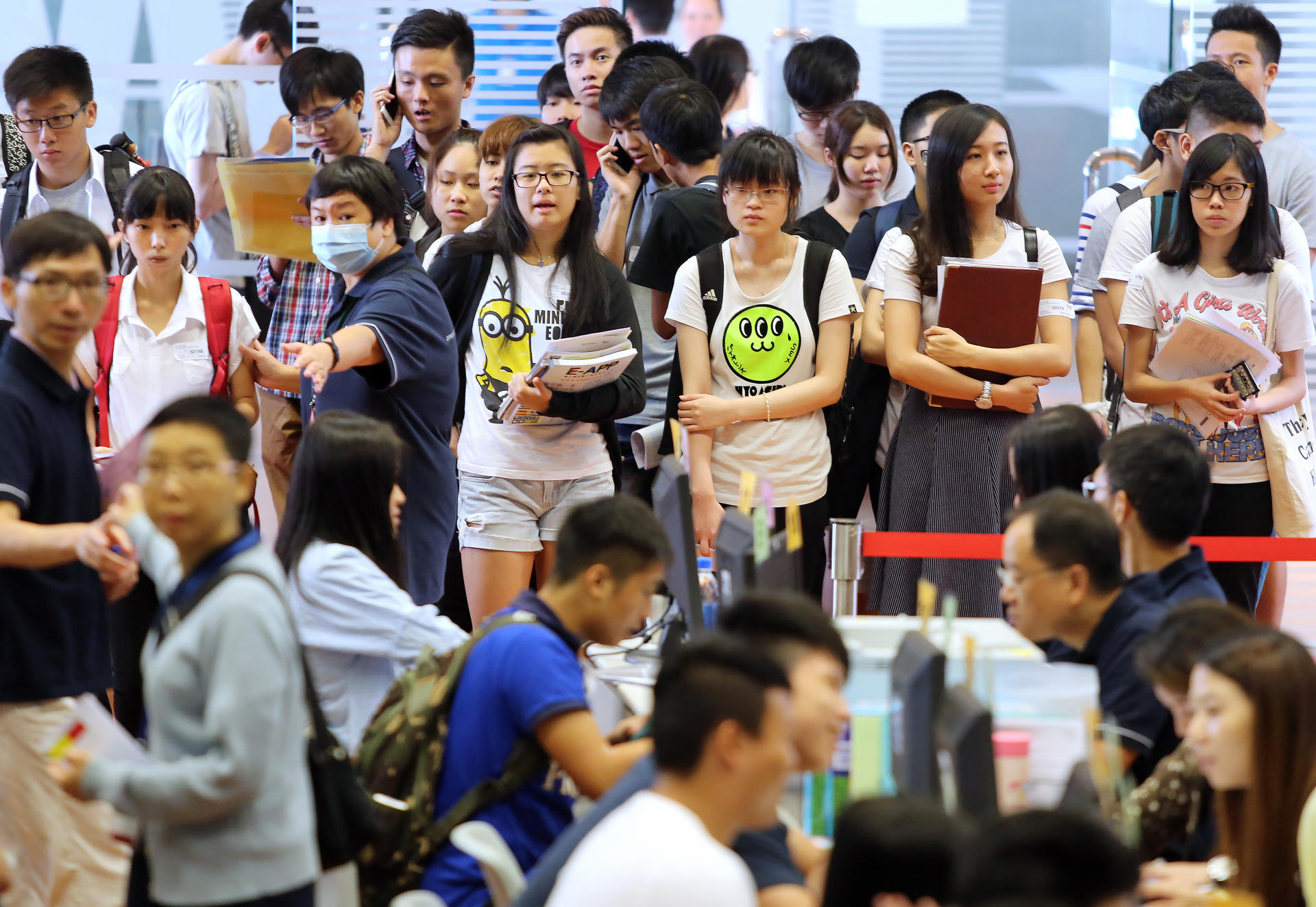 Students queue to apply for university admission. Photo: Sam Tsang