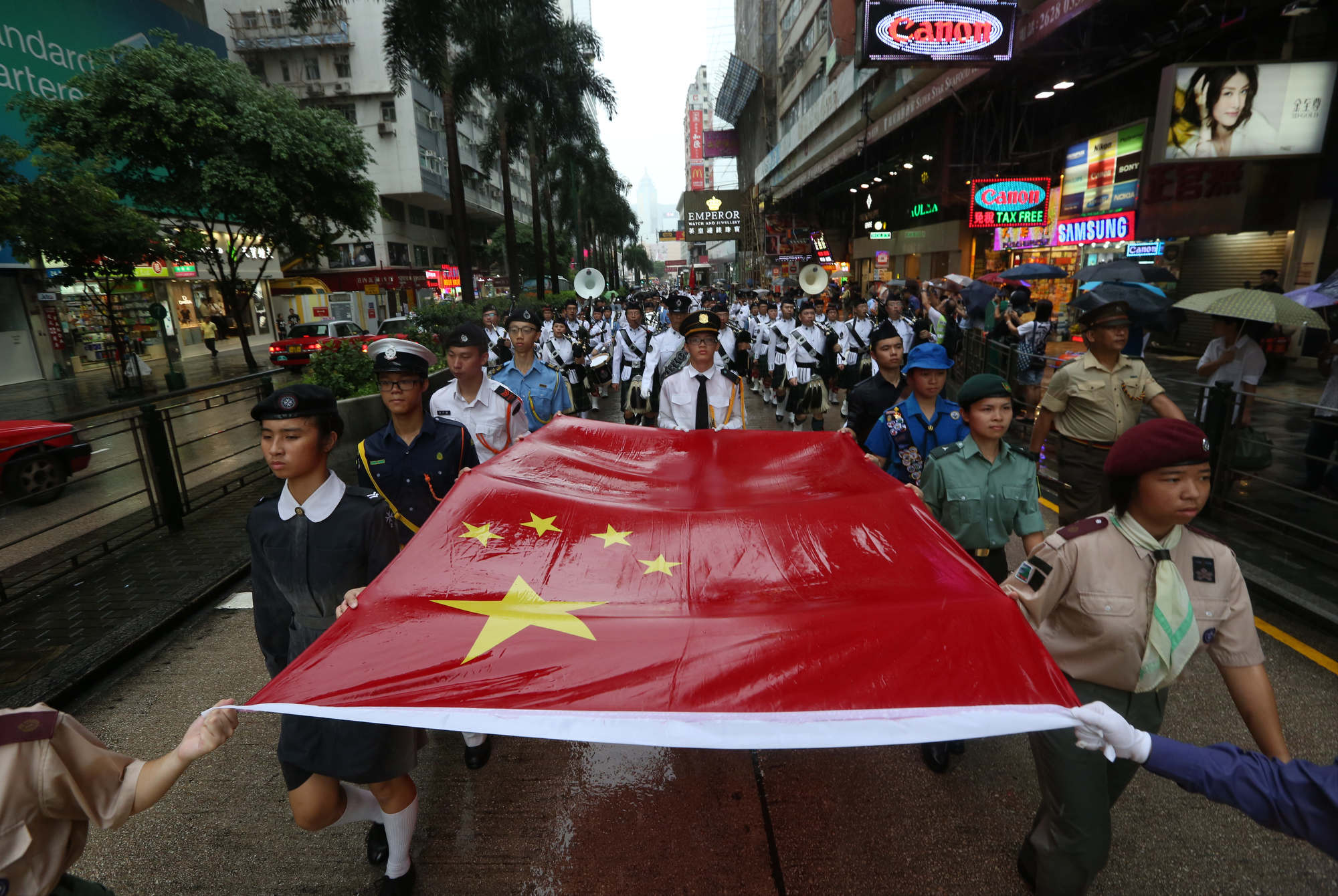 A parade to mark Japan’s withdrawal from Hong Kong in 1945 made its way through Tsim Sha Tsui.  Photo: Nora Tam