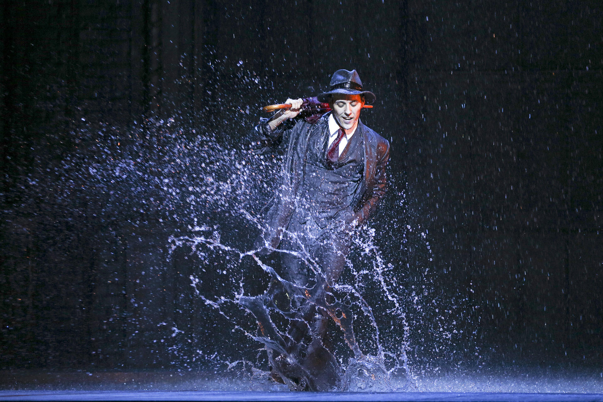 Grant Almirall as Don Lockwood performing the title number.