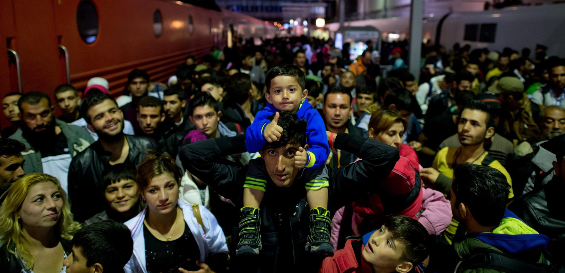 Refugees crowd the platform at the station in Munich.