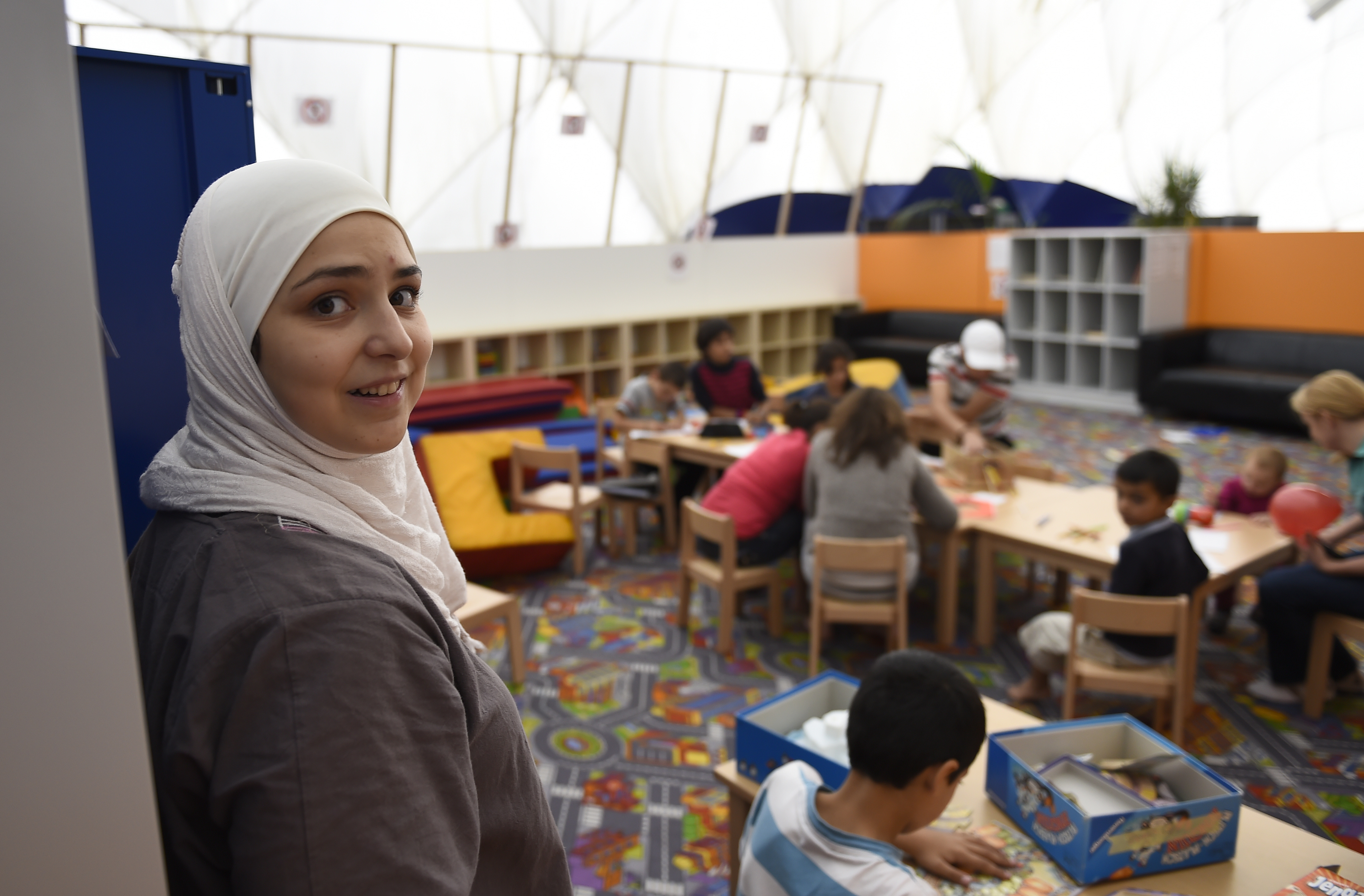 A children's playground inside an air-inflated tent serves as the first registration centre for refugees in Berlin's Moabit district. Photo: AFP