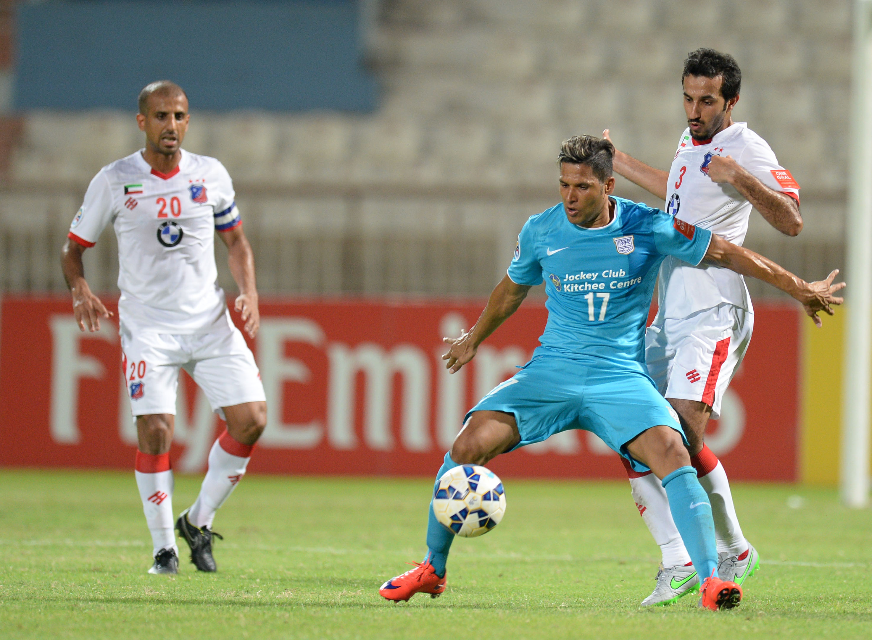 Fahad Awad Shaheen (right) of Al Kuwait SC vies with Paulo Carreiro (centre) of Kitchee in their AFC Cup game. Photo: Xinhua