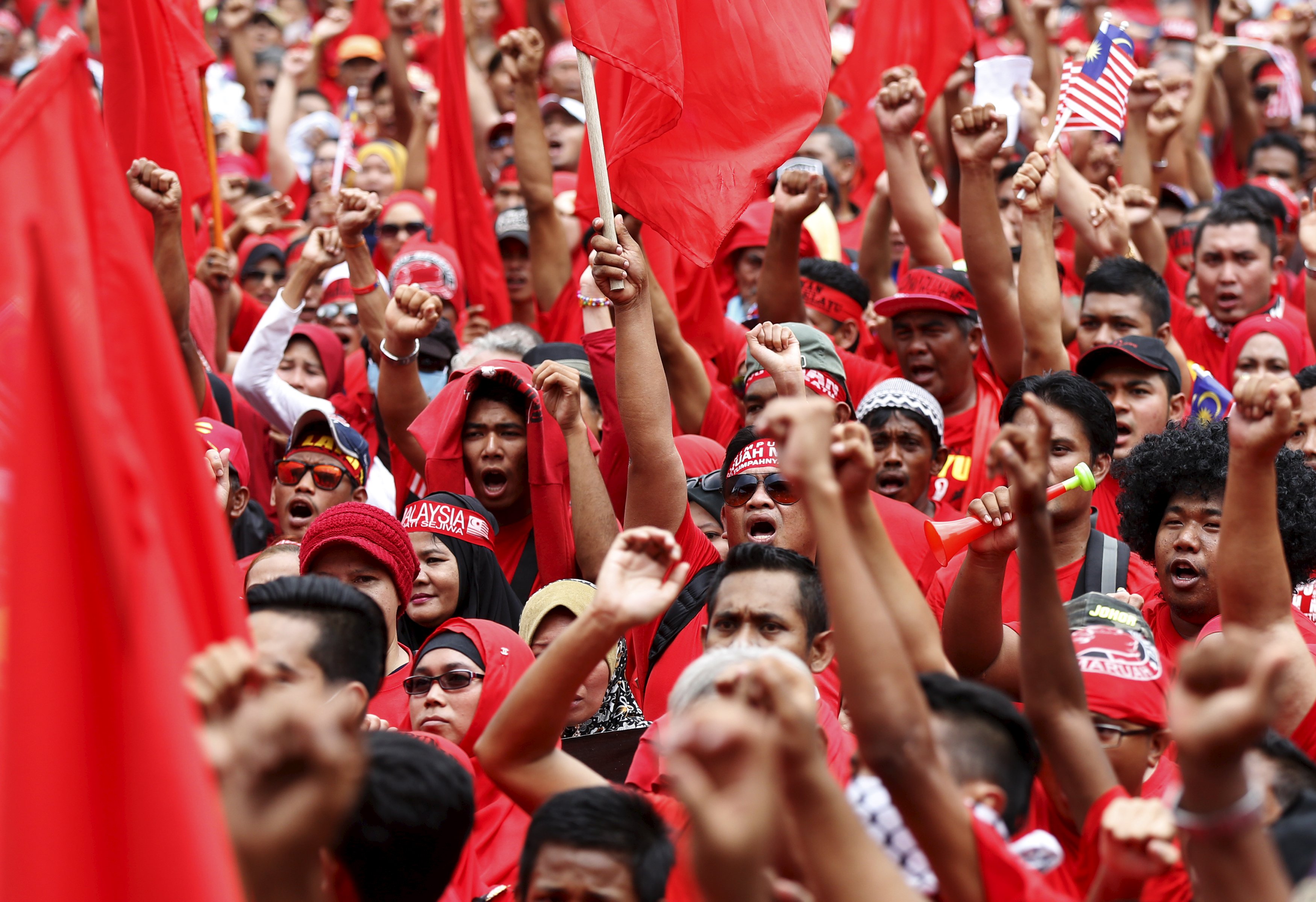"Red shirt" demonstrators in Kuala Lumpur gather in a rally last week, to counter a massive protest last month calling for the prime minister to resign. Photo: Reuters
