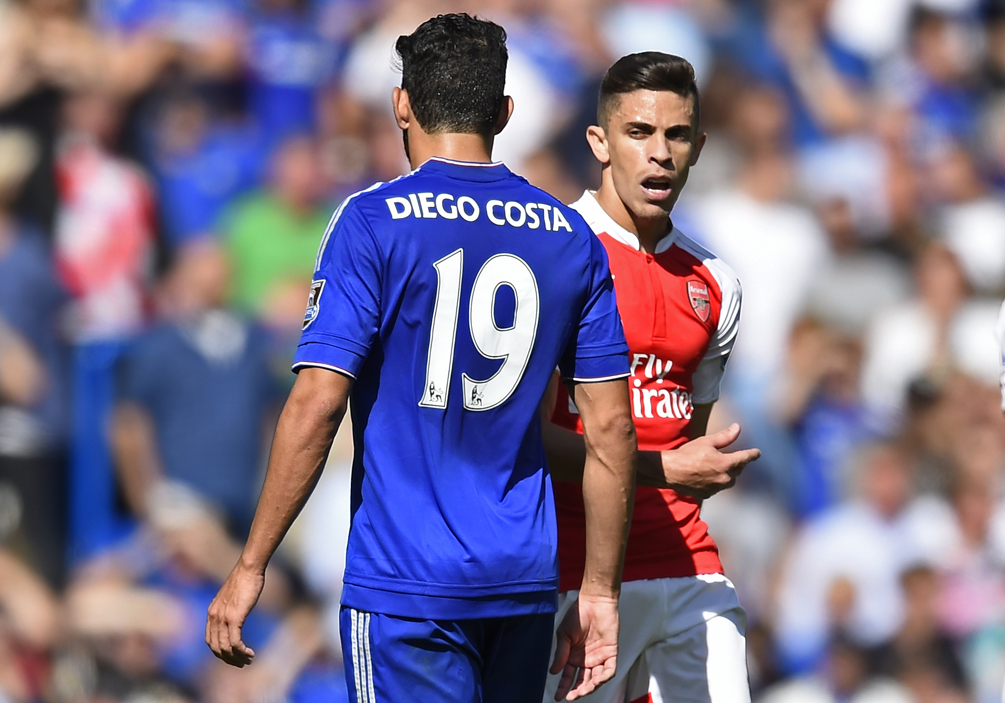Arsenal's Gabriel Paulista walks past Chelsea's Diego Costa after clashing. Photo: Reuters