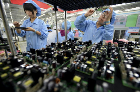 While the argument is that companies will respond to scarce, more expensive workers by investing in labour-saving technology it is unclear which force will be more powerful. Photo: Reuters