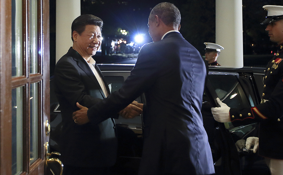 Chinese President Xi Jinping is greeted by US President Barack Obama as he arrives at the White House in Washington DC. Photo: Xinhua
