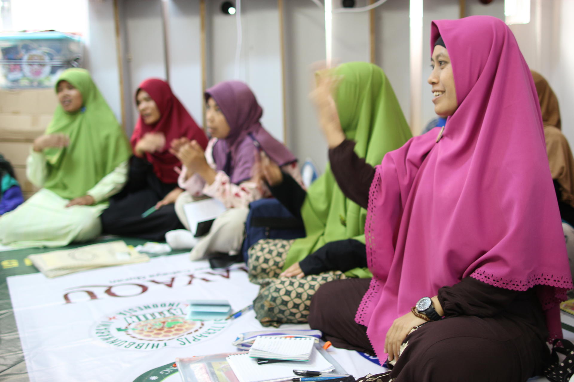 Indonesian domestic helpers attend a class at Cahayaqu school, which offers them free courses in a variety of subjects every weekend.