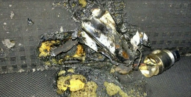 The aftermath of the exploding battery is seen on the burnt car seat upholstery.  Photo: CBS