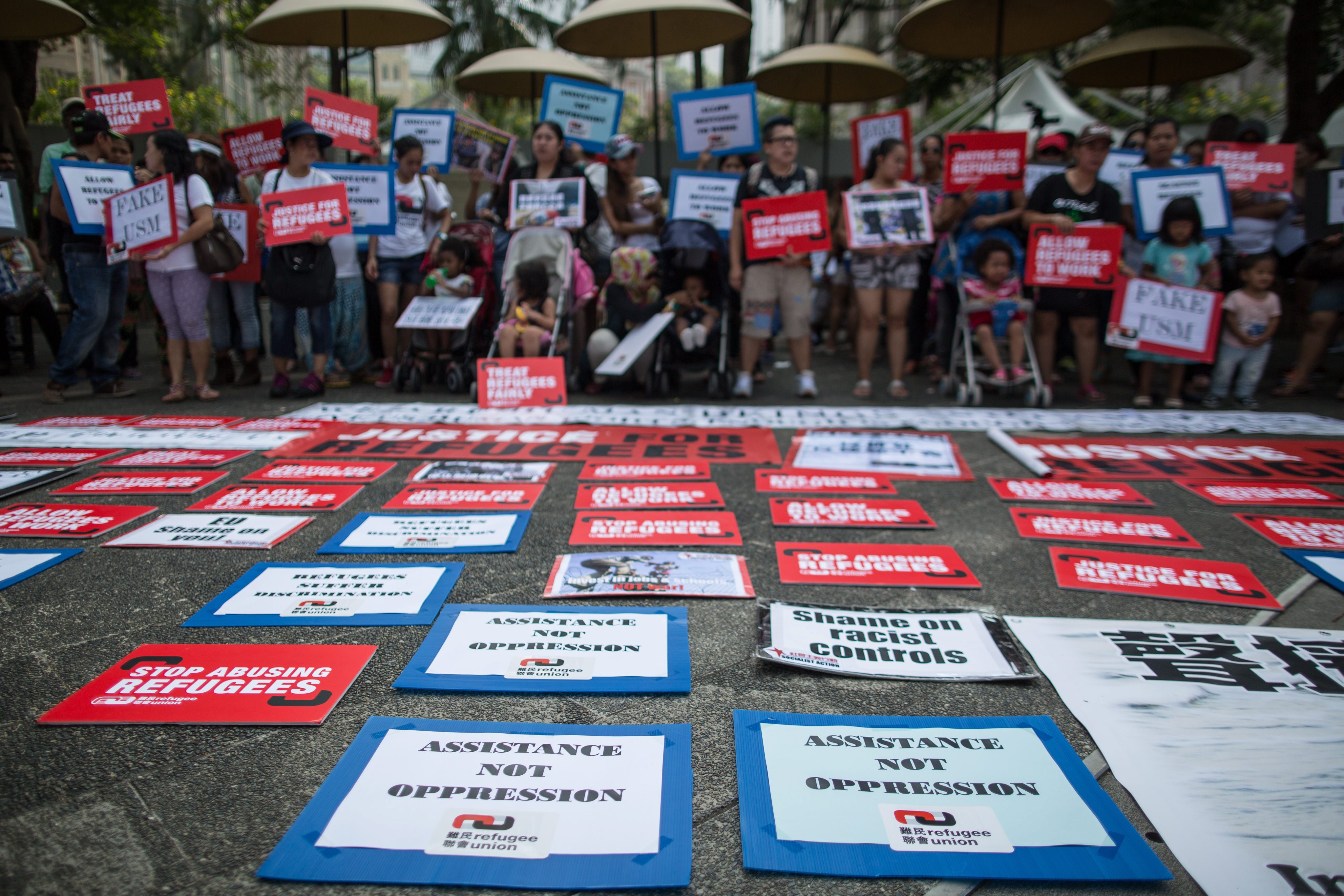 Asylum seekers and their supporters in Hong Kong hold a rally to show their solidarity with the refugees in Europe. Photo: EPA