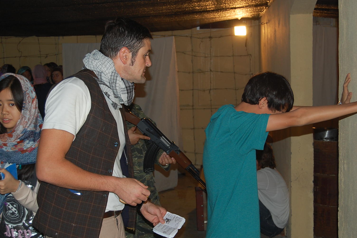 David Begbie interrogates a student during a Refugee Run simulation. Photos: Edward Wong