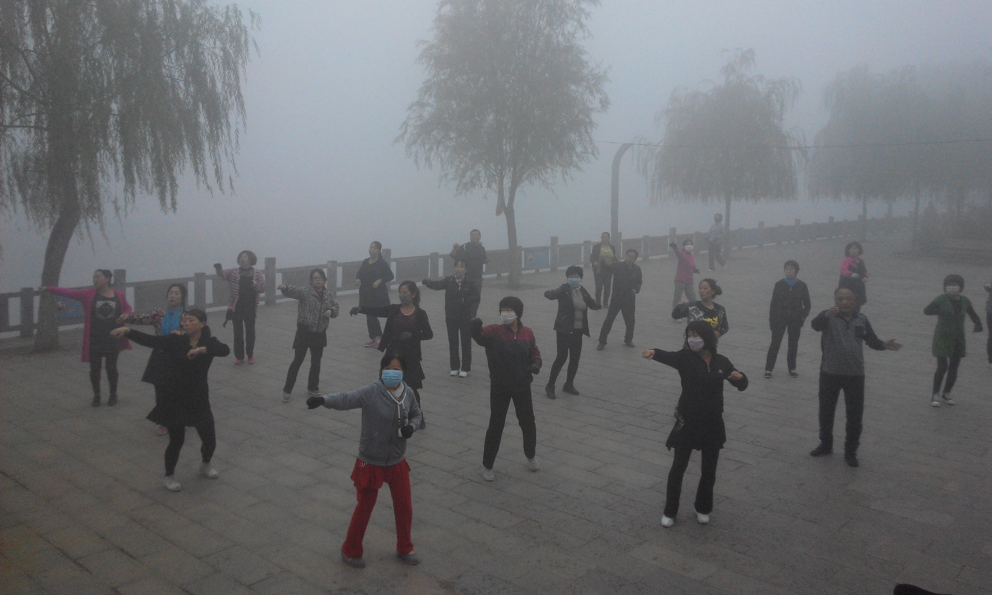Tai chi practitioners don masks for their early morning exercise in Pingquan county, Hebei province on Tuesday. Photo: Xinhua