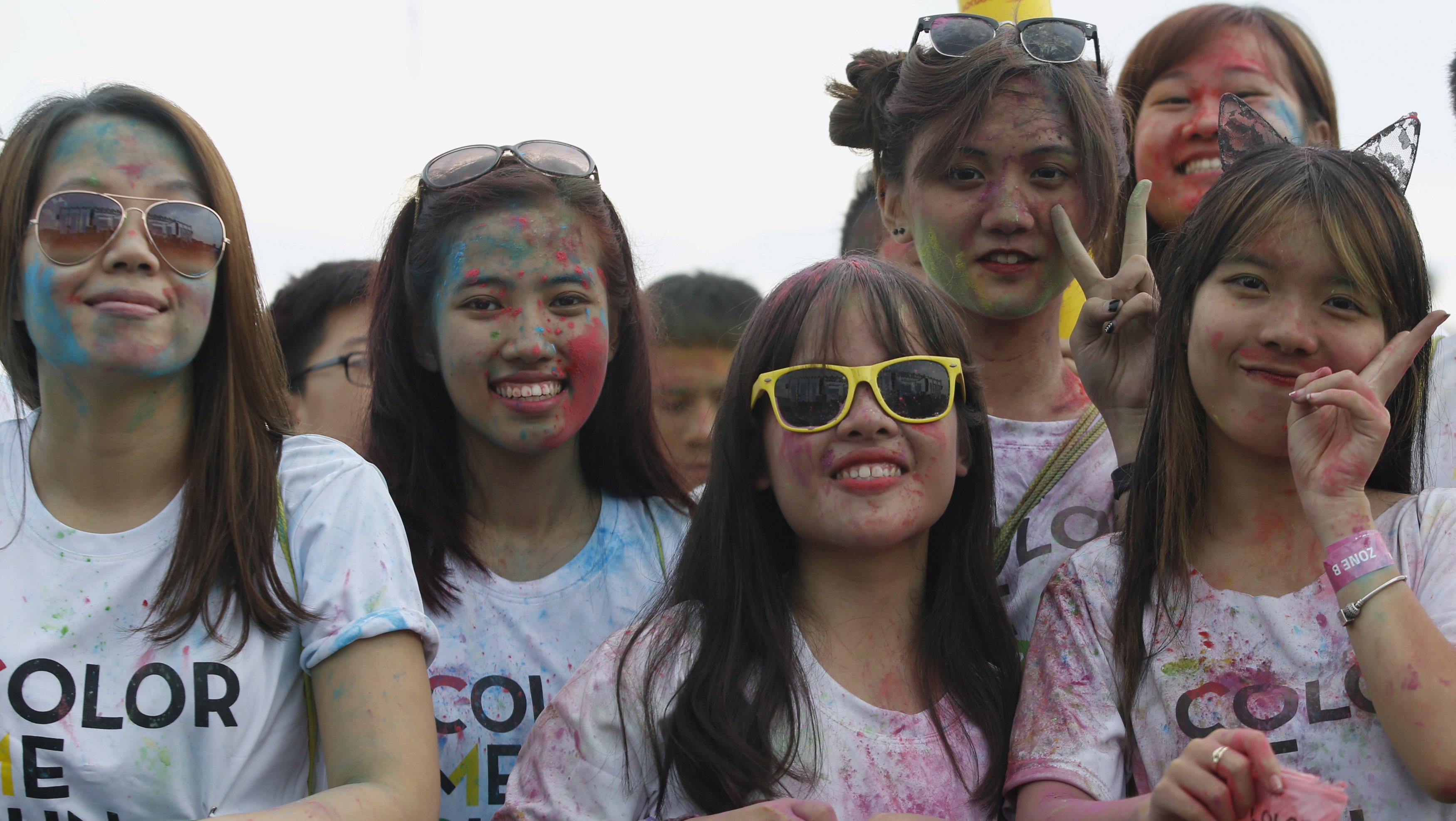 Women in Hanoi take part in a "colour run". Bringing women into the workforce is no longer a choice but a necessity. Photo: Reuters