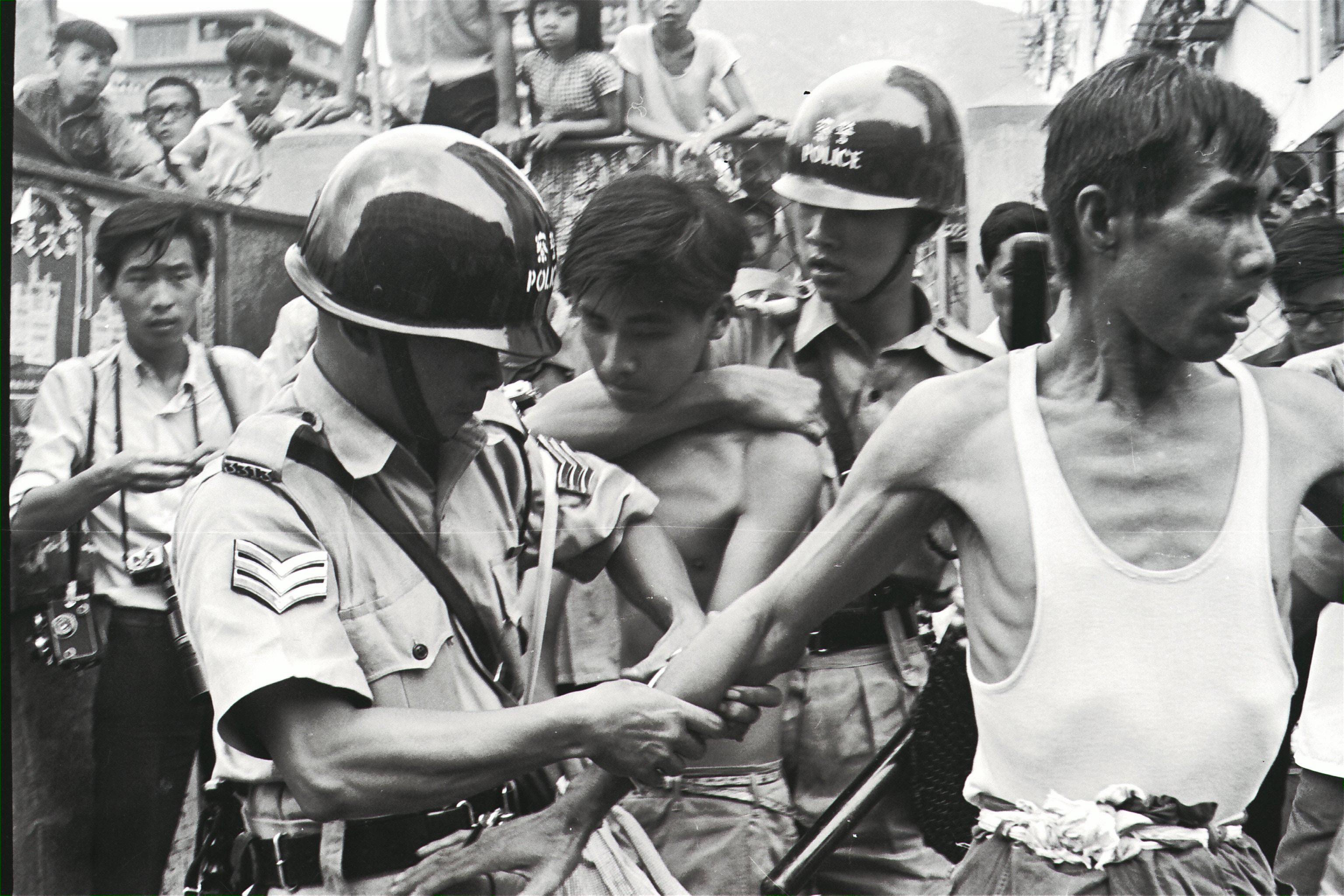 Police arrested two left-wing demonstrators during a clash in San Po Kong in 1967. Photo: SCMP Pictures