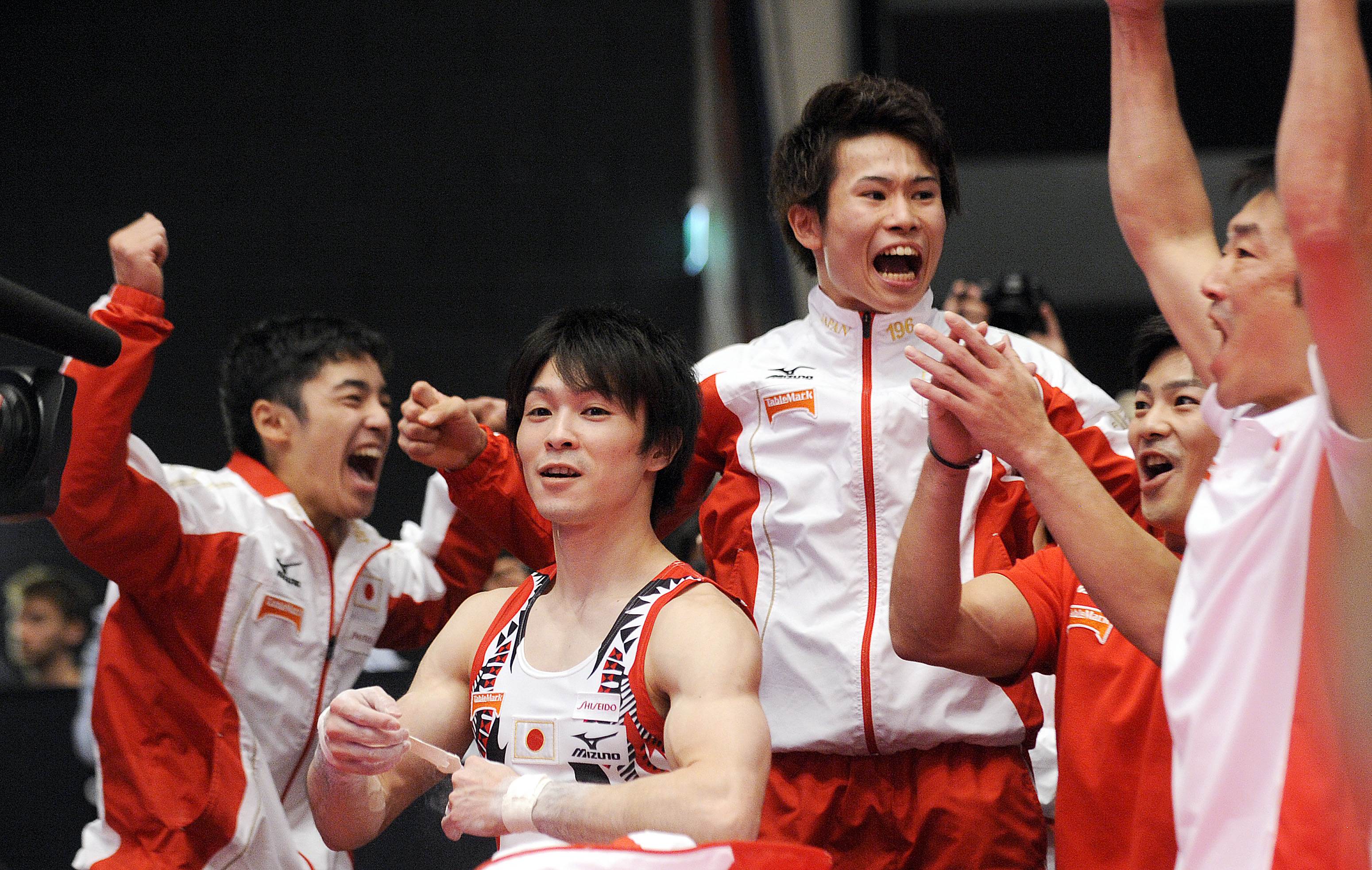 Japan celebrate their win. Photo: AFP