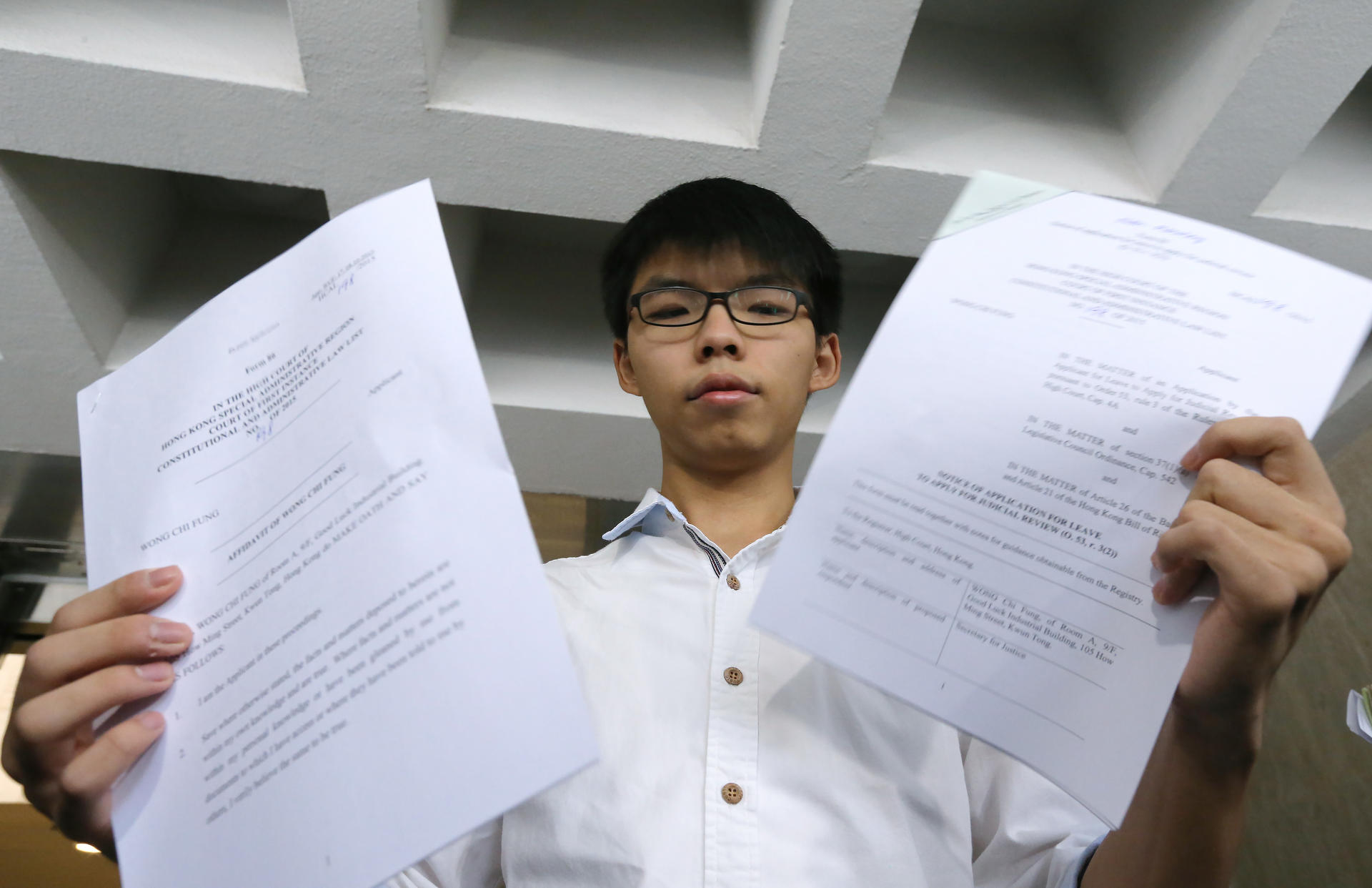 Joshua Wong is challenging the age threshold for running in Legco elections. Photo: Felix Wong