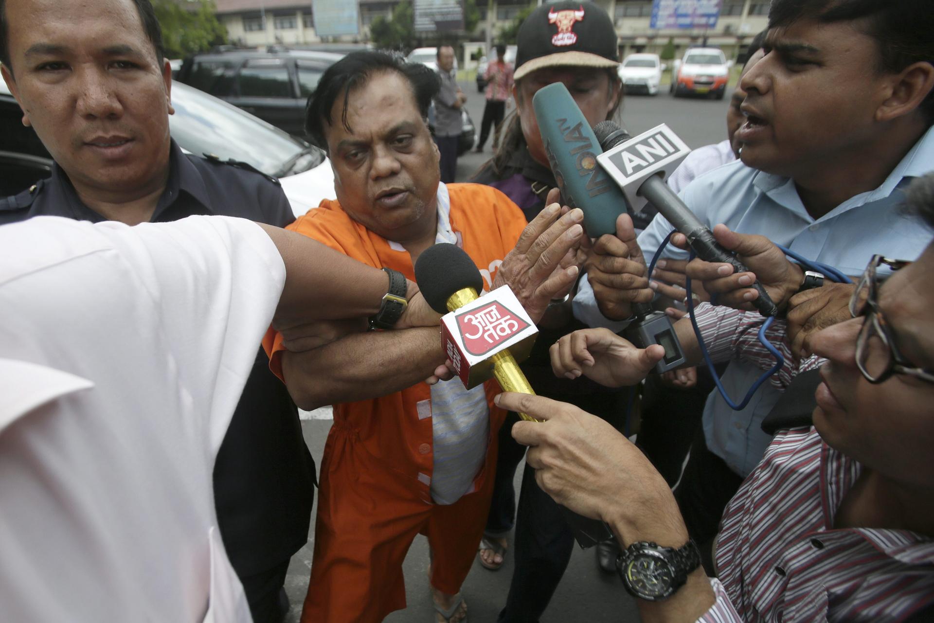 Rajendra Sadashiv Nikalje - known as Chhota Rajan - in custody outside Bali Police headquarters in Denpasar, Indonesia.Photos: EPA