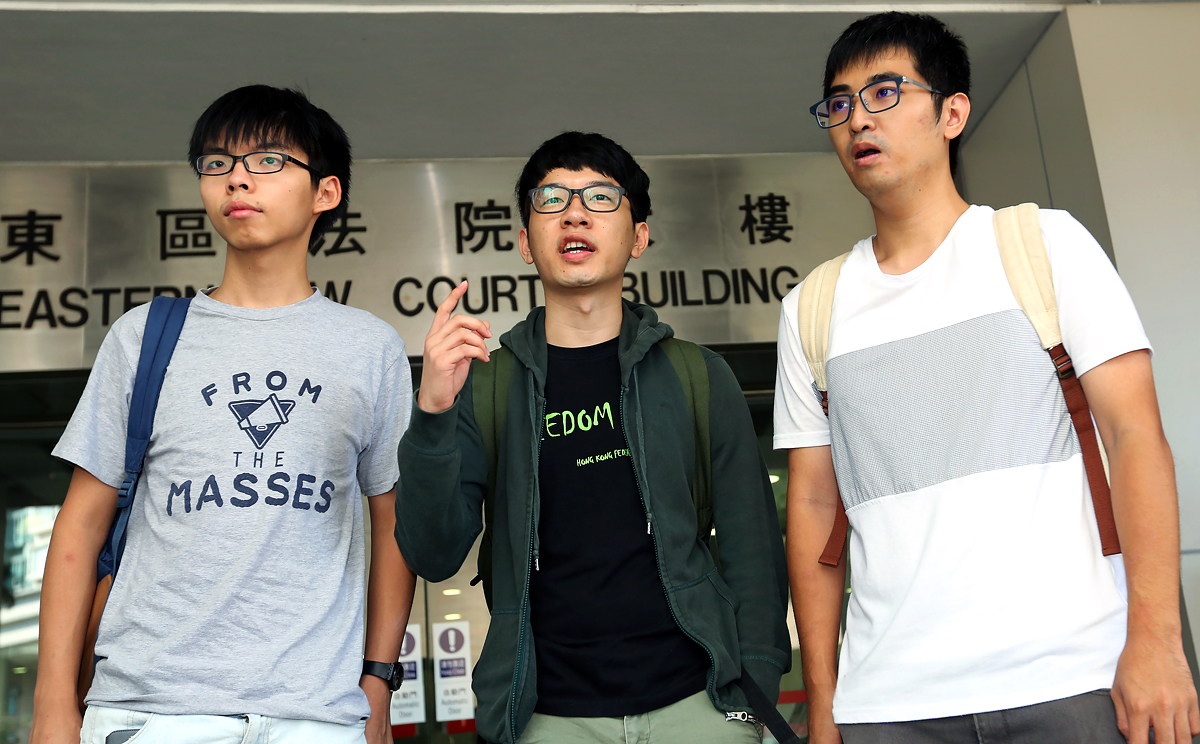 (From left) Joshua Wong Chi-fung, Nathan Law Kwun-chung and Alex Chow Yong-kang arrive Eastern Court for the pre-trial review in October, 2015. It takes courage and commitment for students to throw themselves into the dark and dirty valley of politics. Photo: Edward Wong