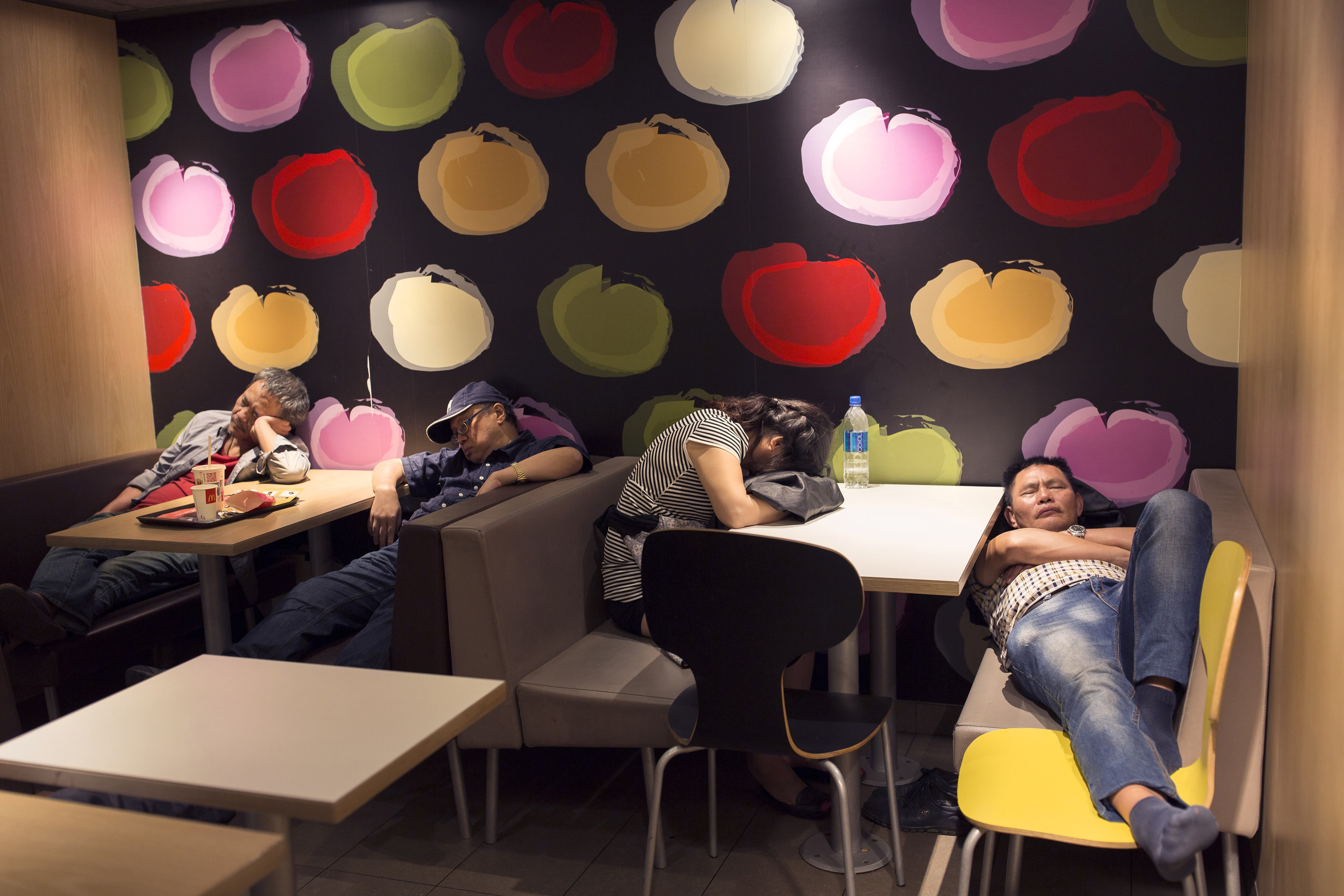Dubbed "McRefugees", people sleep at night in 24-hour McDonald’s branches around Hong Kong due to homelessness. Photo: AP