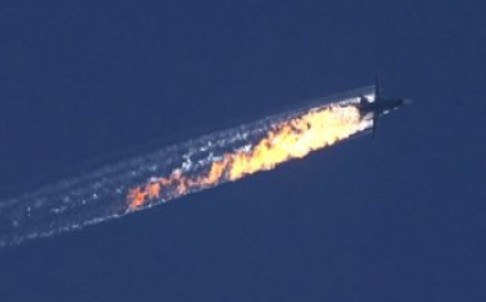 The Su-24 bomber hit by Turkey's an air-to-air missile falling from the sky. Photo: EPA