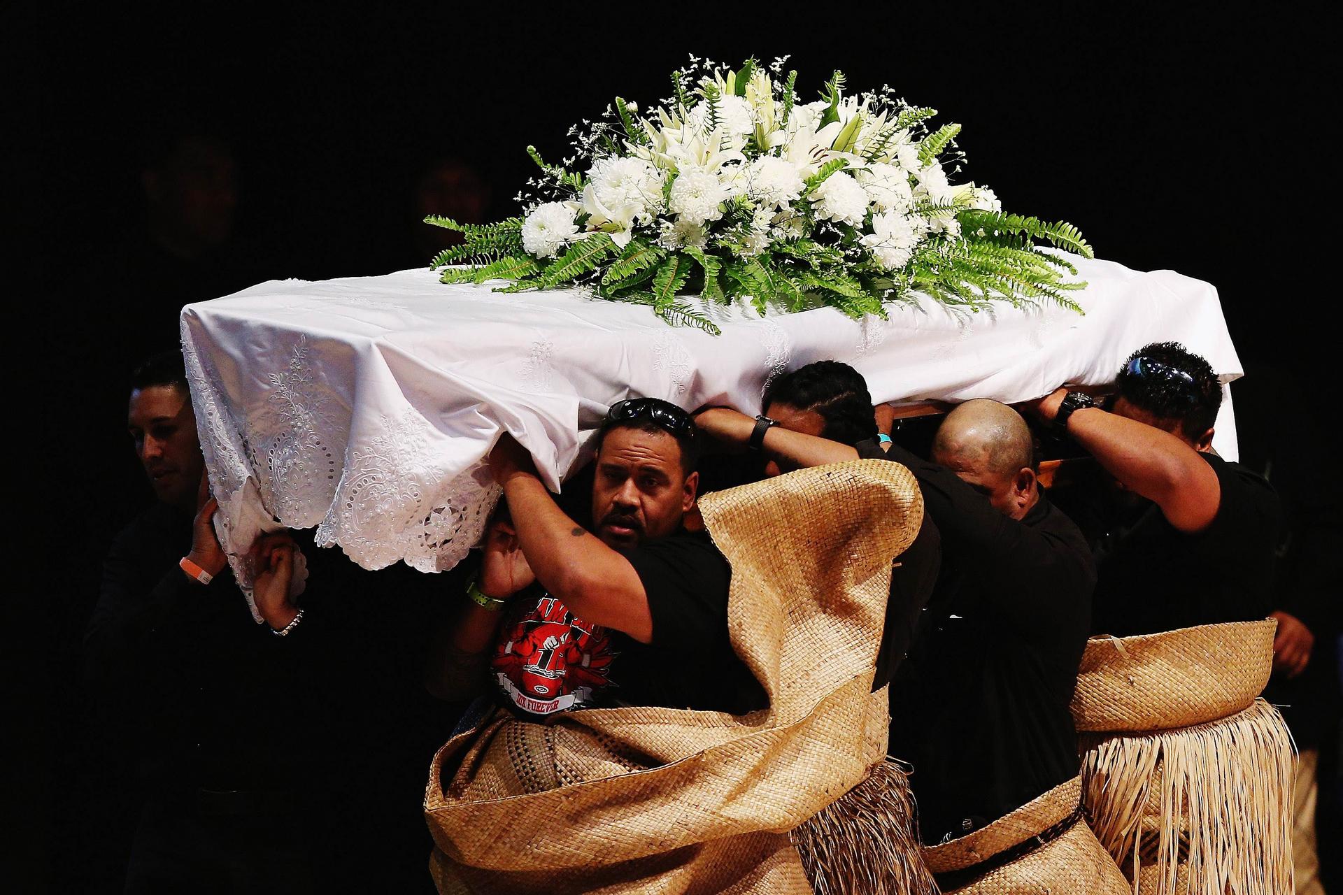 The casket containing Jonah Lomu is carried out. Photos: AFP