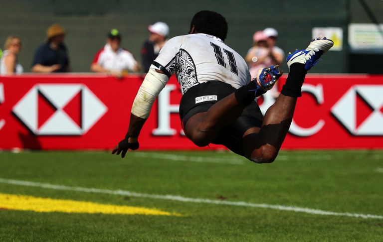 Fiji’s Savenaca Rawaca appears to fly over the paint as he scores a try against Japan during December’s Dubai Sevens – the first stop on the 2015-16 World Rugby HSBC Sevens Series tour. Photo: AFP