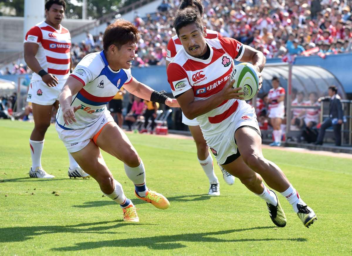 Japan captain and scrum-half Keisuke Uchida runs in one of his side's 13 tries in an 85-0 romp over South Korea in the 2016 ARC opener last weekend. Photo: AFP