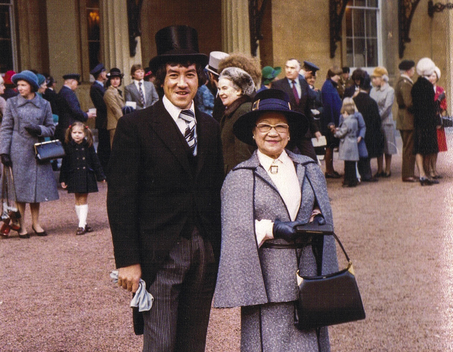 Writer Ian Gill with his mother, Louise Mary Gill, at London’s Buckingham Palace, in 1977, to receive her MBE. Photos: courtesy of the Gill family