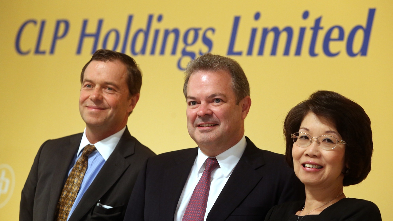 (L to R) Geert Peeters, group director and chief financial officer; Richard Lancaster, chief executive officer of CLP Holdings Limited and Betty Yuen So Siu-mei, vice chairman of CLP Power Hong Kong Limited, pose for a photograph during CLP Holdings Limited 2015 Interim Results at Kowloon Shangri-La in Tsim Sha Tsui. Photo: Sam Tsang