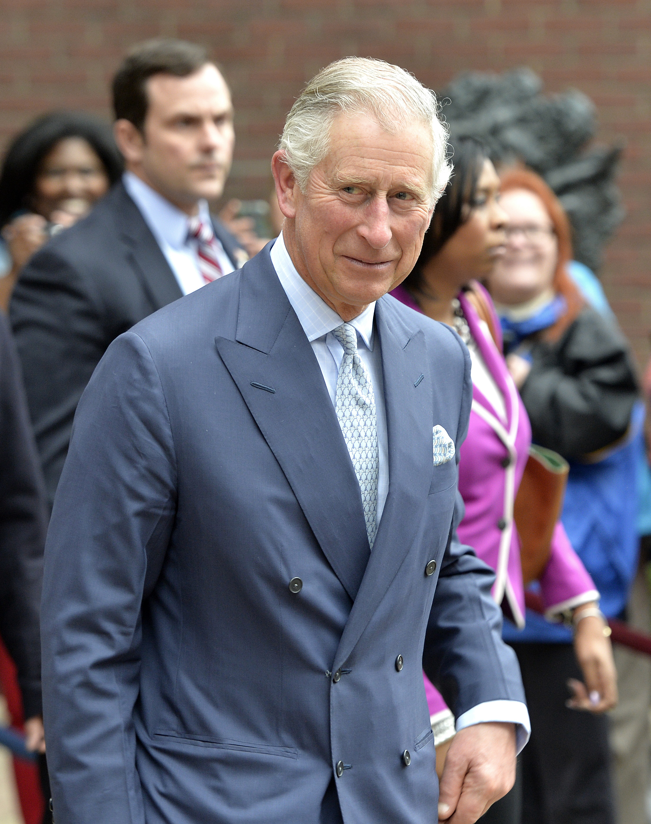 Britain's Prince Charles, left, smiles at the crowd outside of the Cathedral of The Assumption in Louisville, Ky., Friday, March 20, 2015. The Kentucky stop comes after a visit to Washington, D.C. (AP Photo/Timothy D. Easley)
