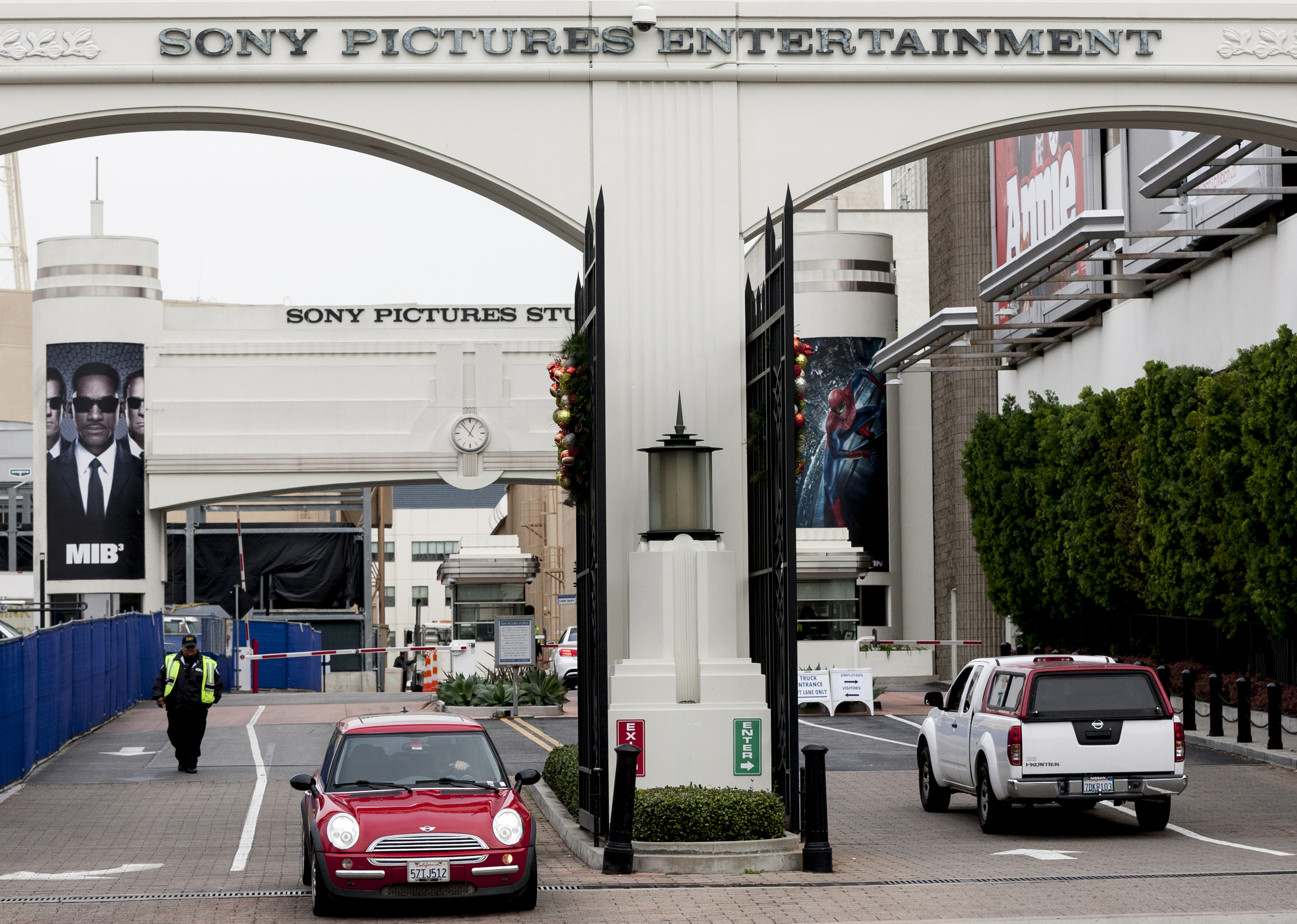 FILE - This Dec. 18, 2014 file photo shows the entrance of Sony Pictures Entertainment studio lot in Culver City, Calif. Sony Pictures Entertainment has reached a settlement with current and former employees, agreeing to pay up to $8 million to reimburse them for losses, preventative measures and legal fees related to the hack of its computers last year. The settlement was filed with the U.S. District Court in Los Angeles late Monday, Oct. 19, 2015. (AP Photo/Damian Dovarganes, File)