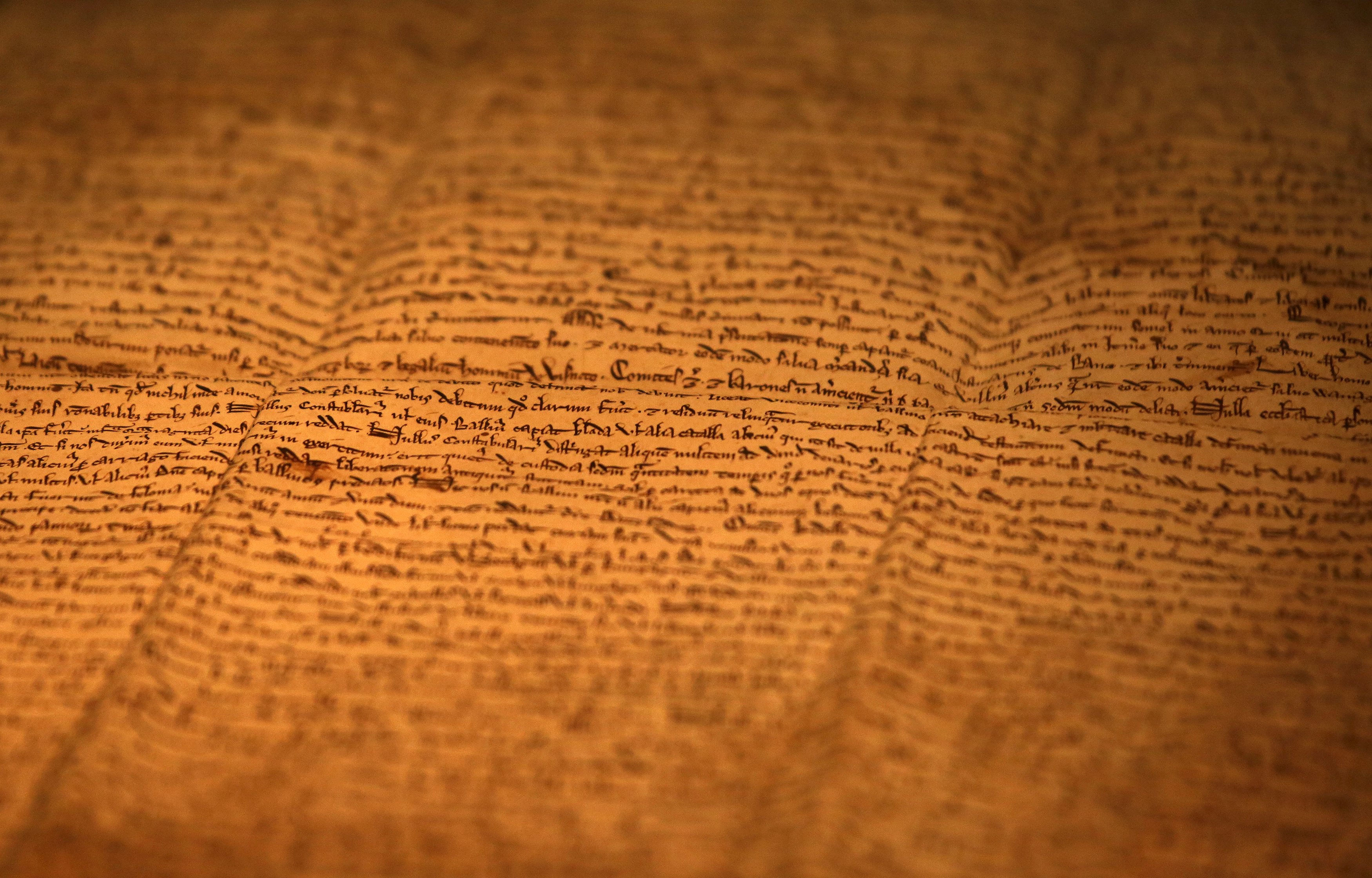 One of the few surviving copies of Magna Carta, Latin for "The Great Charter" written in 1217 on sheep skin is displayed at an exhibition in Hong Kong, China, November 10, 2015. The exhibition is part of a worldwide celebrations of its 800th anniversary, British Consulate in Hong Kong said. REUTERS/Bobby Yip