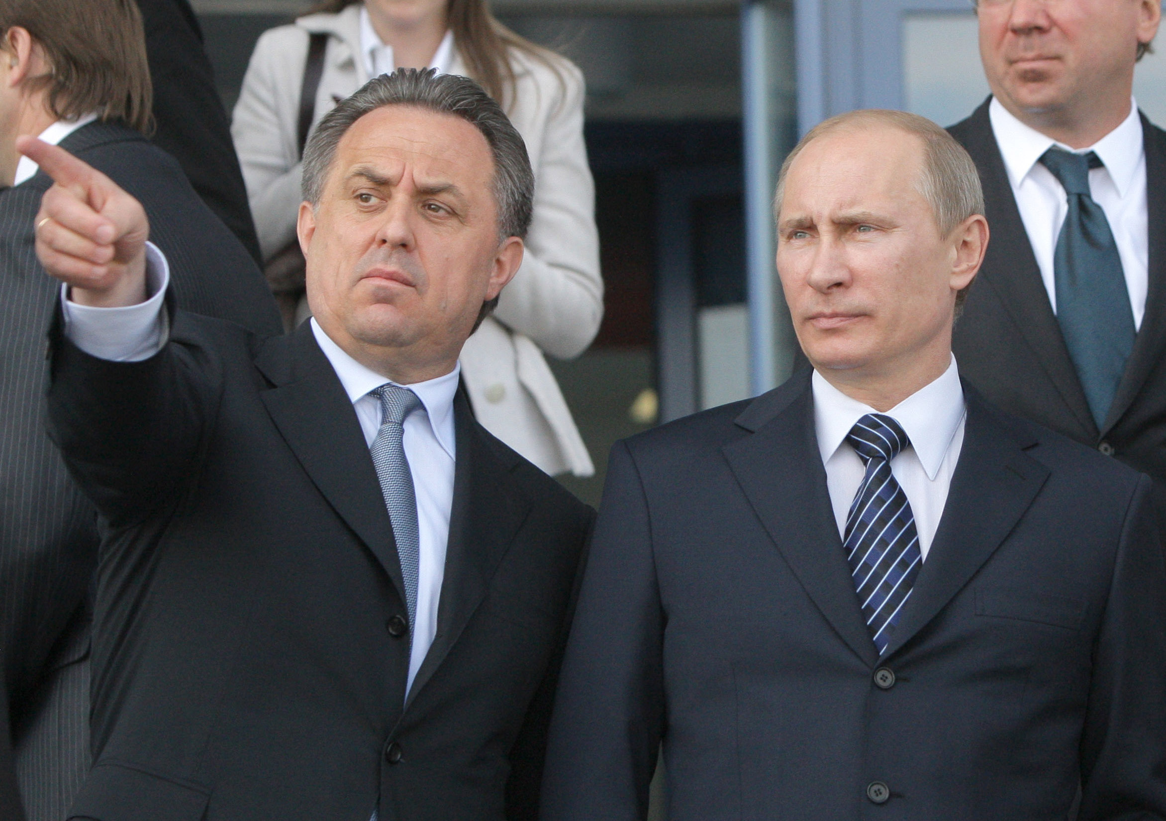 FILE - In this May 16, 2011 file photo then Russian Prime Minister Vladimir Putin, right, is flanked by Sports Minister Vitaly Mutko, left, as they visit a sports complex that is under construction for the 2014 Winter Olympic Games, in Krasnodar, southern Russia. WADA's independent commission said Monday, Nov. 9, 2015 Russia's athletics federation should be suspended and its track and field athletes banned from competition until the country cleans up its act on doping. (AP Photo/RIA Novosti, Alexei Druzhinin, Pool, file)