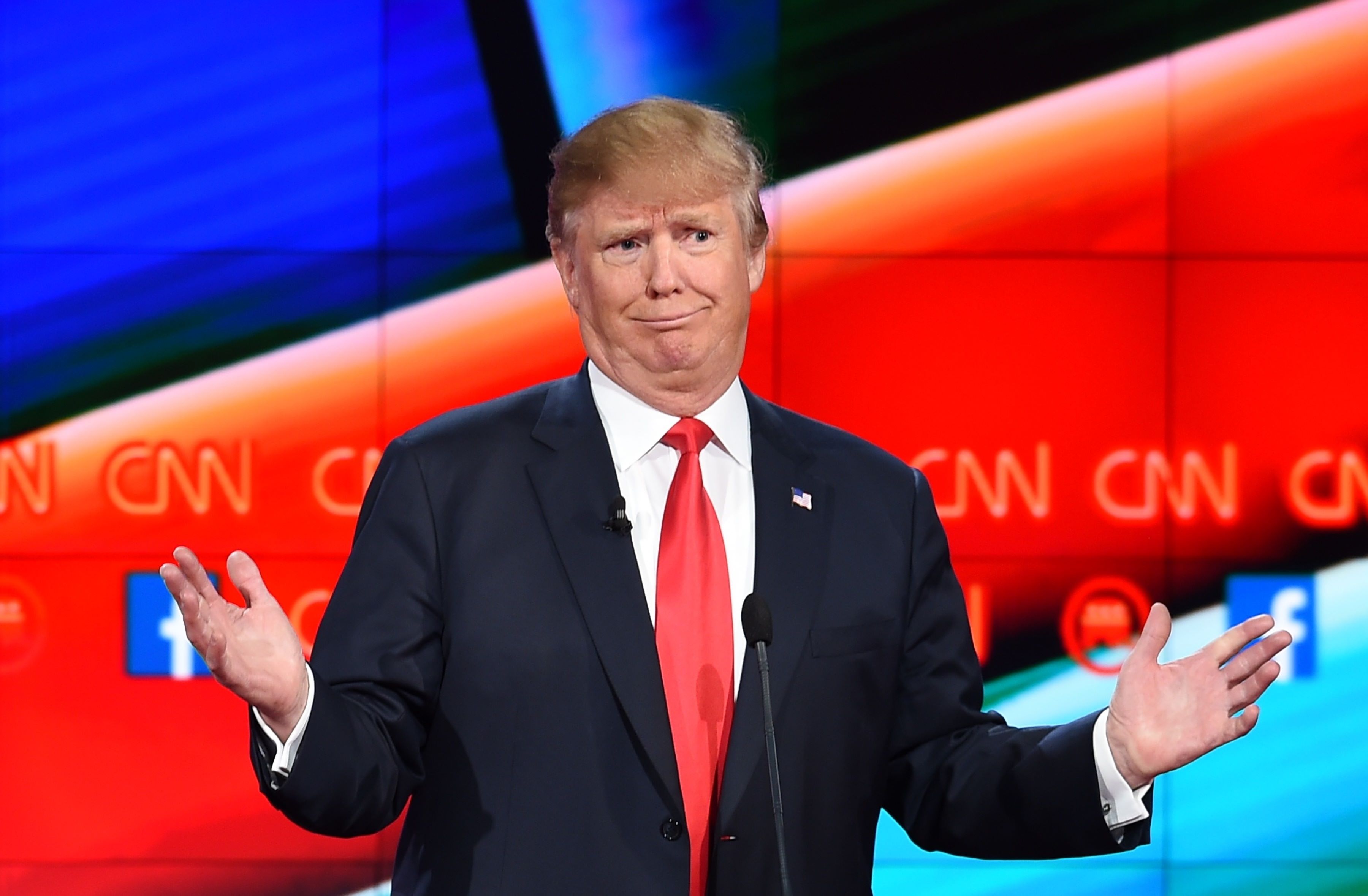 (FILES) - A file picture taken on December 15, 2015 in Las Vegas, Nevada, shows Republican presidential candidate Donald Trump during a presidential debate. Good. Bad. Stupid. When it comes to his choice of words, Donald Trump keeps it simple. So simple, in fact, that even a nine-year-old can get what the Republican White House frontrunner is saying, according to a test developed for the US Navy. AFP PHOTO/ ROBYN BECK